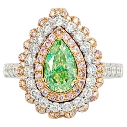 18kt white gold ring with diamonds
  
  Gold colour & karat: White gold 18kt
  Weight: 6.473 grams
  
  Set with-
  Stone type: Diamonds
  Shape: Pear
  Carat: 1.03
  Colour: Fancy Light Greenish Yellow  
  Clarity: I2
  
  Surrounding Stones: