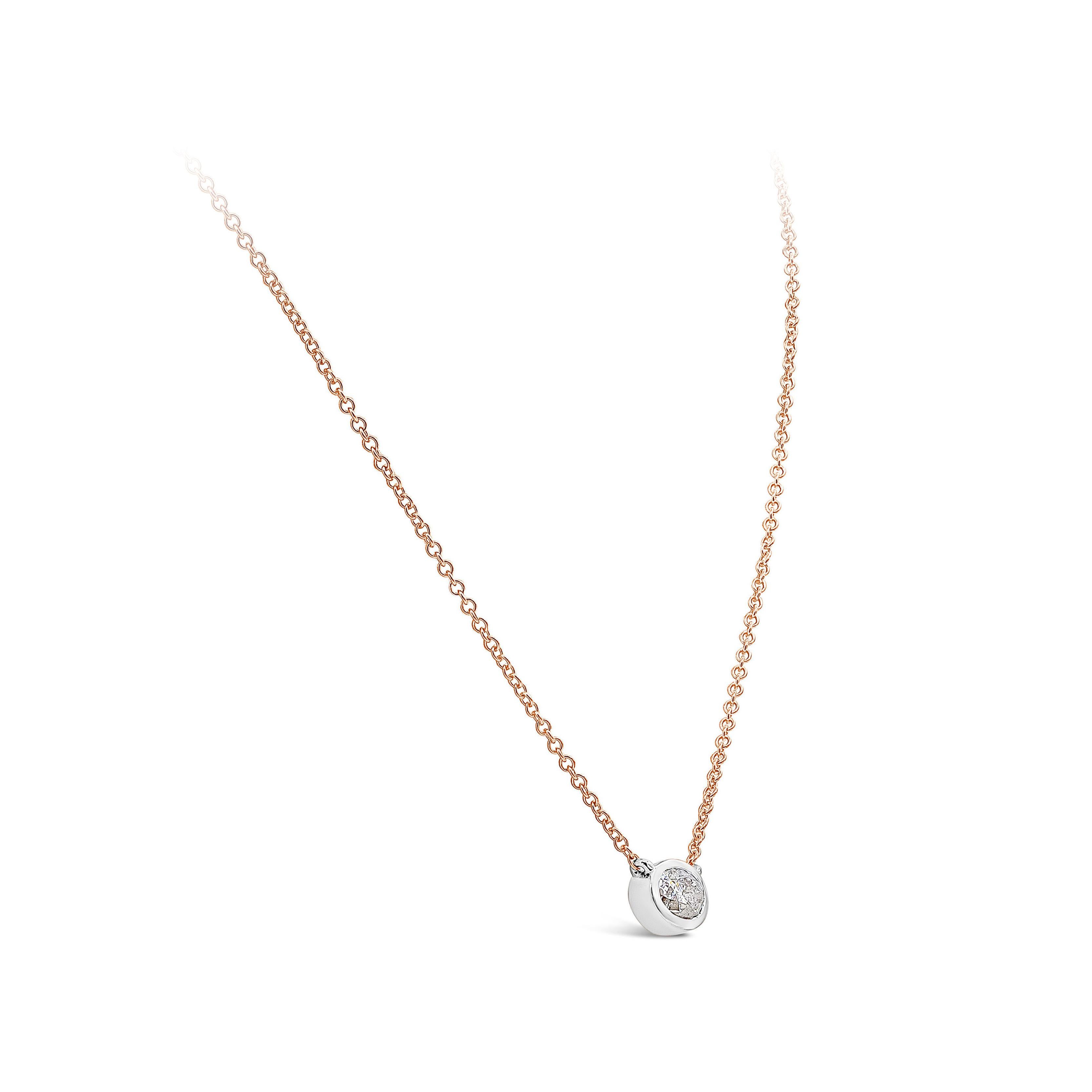 A simple pendant necklace showcasing a GIA Certified 1.03 carat oval cut diamond, I Color and I2 in Clarity. Set in 14K White Gold Bezel, suspended on a 16 inch 14K rose gold chain. 16 inches in Length. 

Style available in different price ranges.