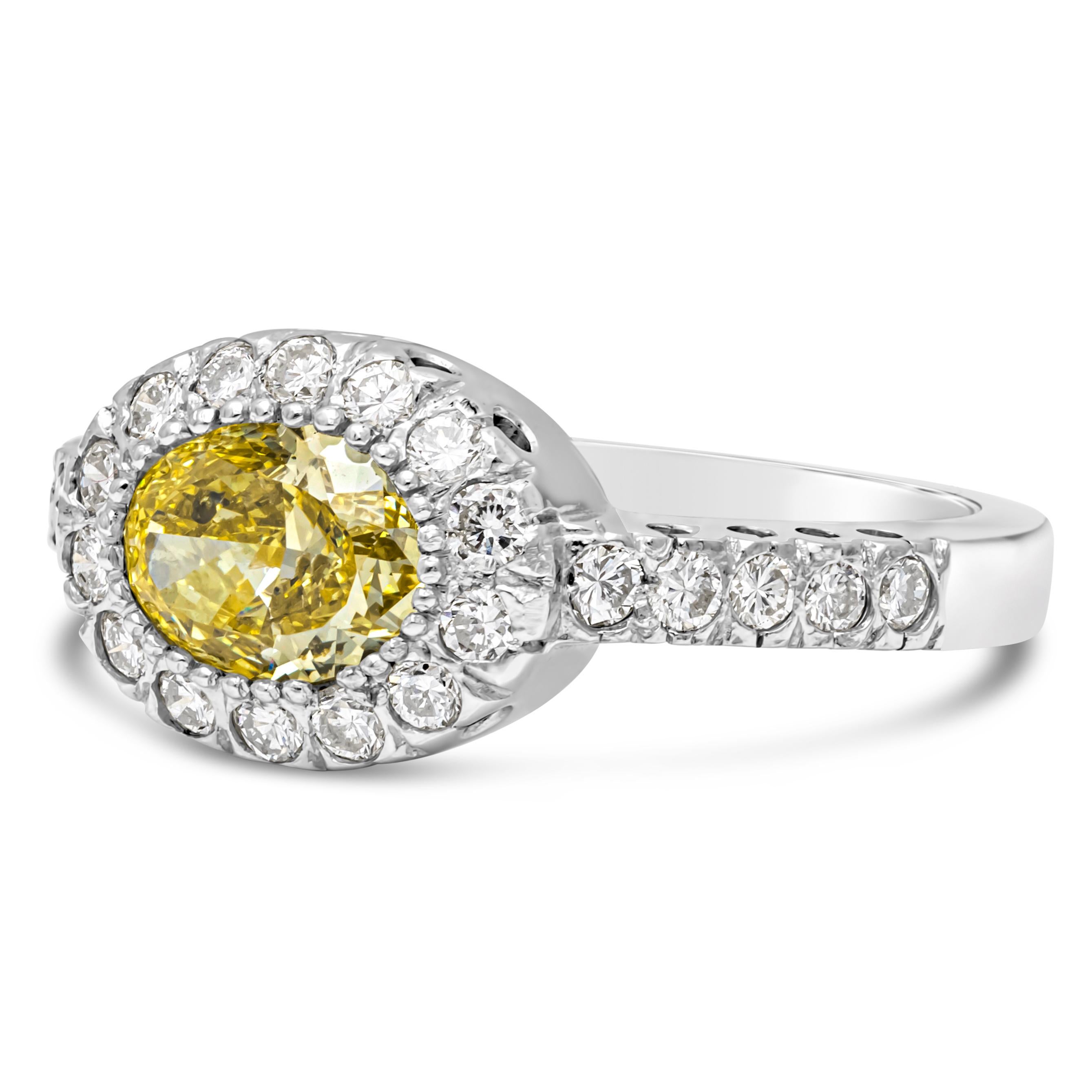 Contemporary GIA Certified 1.03 Carats Oval Cut Fancy Yellow Diamond Halo Engagement Ring For Sale