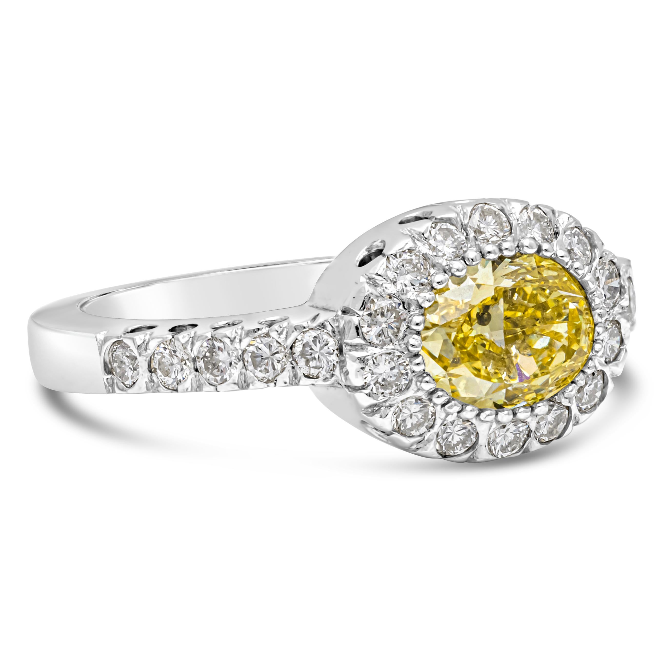 GIA Certified 1.03 Carats Oval Cut Fancy Yellow Diamond Halo Engagement Ring In New Condition For Sale In New York, NY