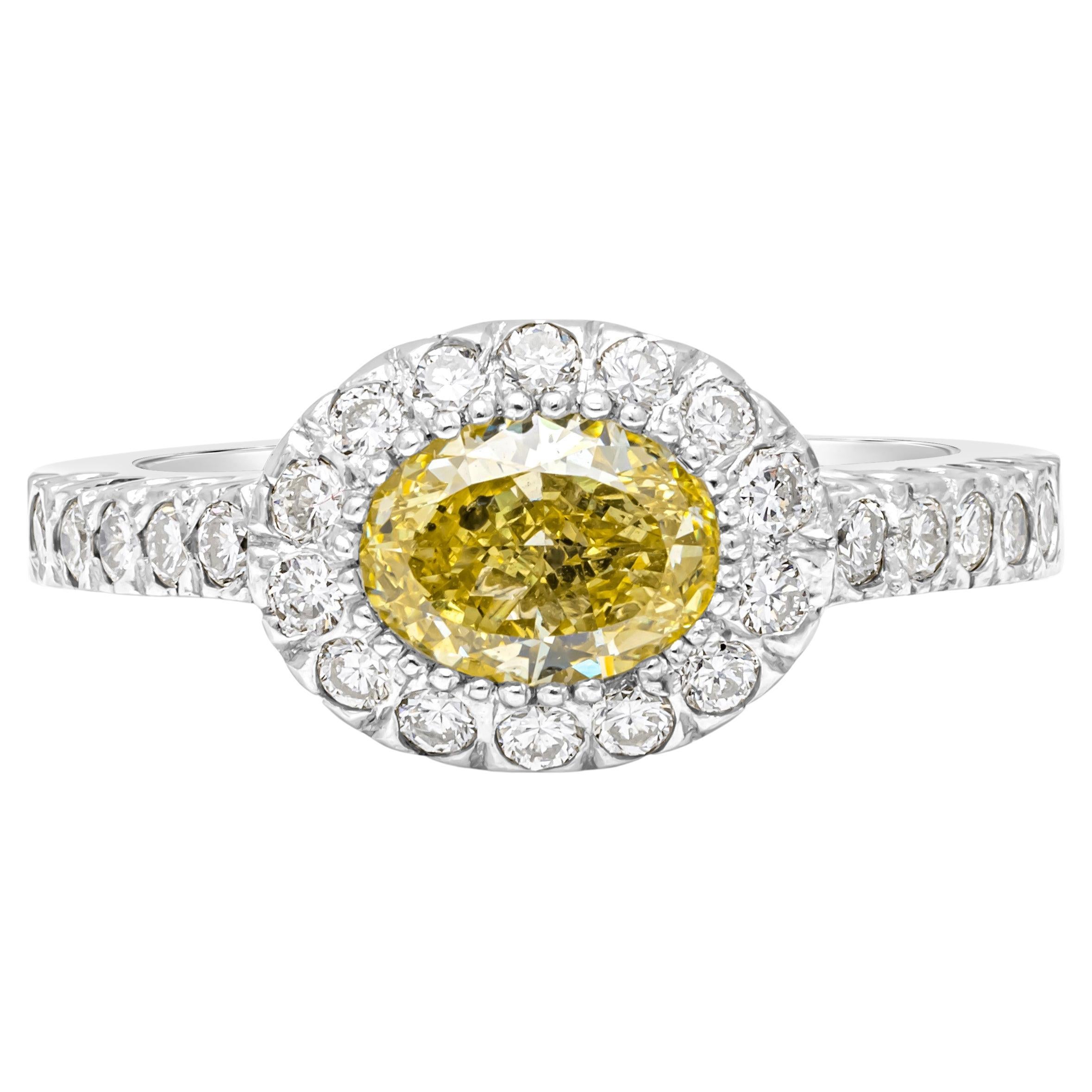 GIA Certified 1.03 Carats Oval Cut Fancy Yellow Diamond Halo Engagement Ring For Sale