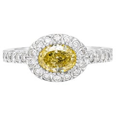 GIA Certified 1.03 Carats Oval Cut Fancy Yellow Diamond Halo Engagement Ring