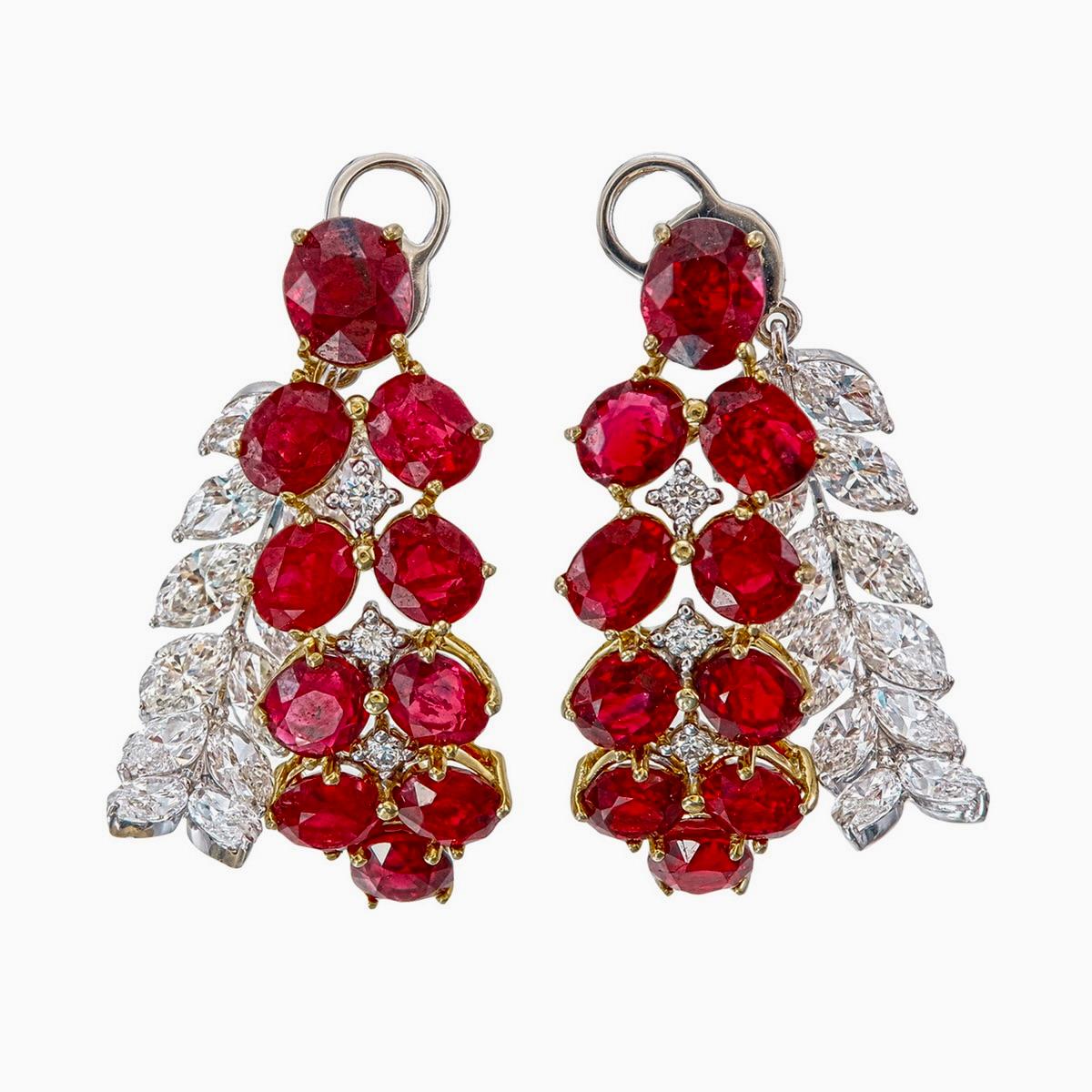 A brand new premium ruby and diamond earrings crafted by Rewa jewels in 18 karat white gold.

This stunning piece has 20 untreated Burmese rubies weighing approximately 10.31 carat in total. The rubies in these pair of earrings have been certified