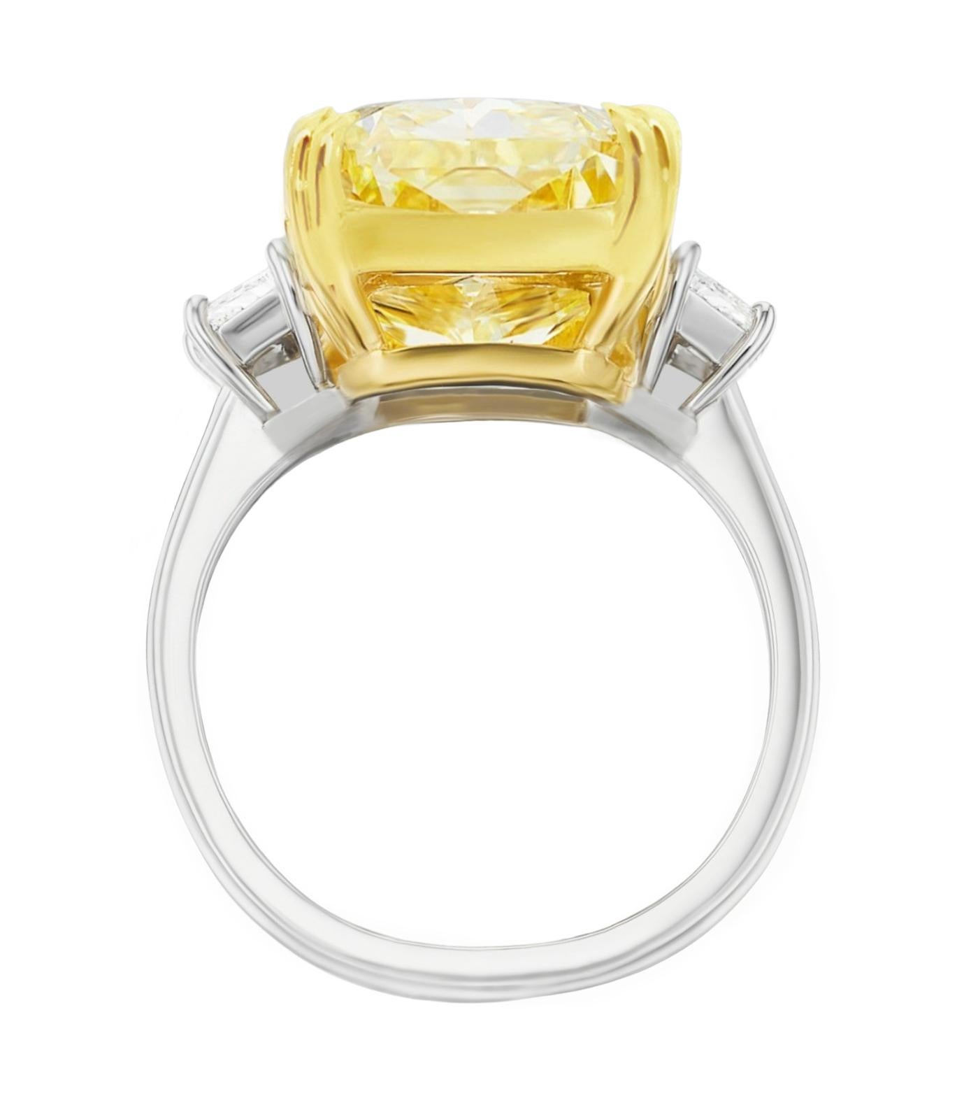 This Stunning Antinori di San Pietro ROMA GIA Certified 10.35 Carat Fancy Yellow Diamond is made in 18K white and Yellow Gold. The 2 white diamond trapezoid on either side of the center stone are 100% eye clean and full of brilliance. 
VVS2 Clarity