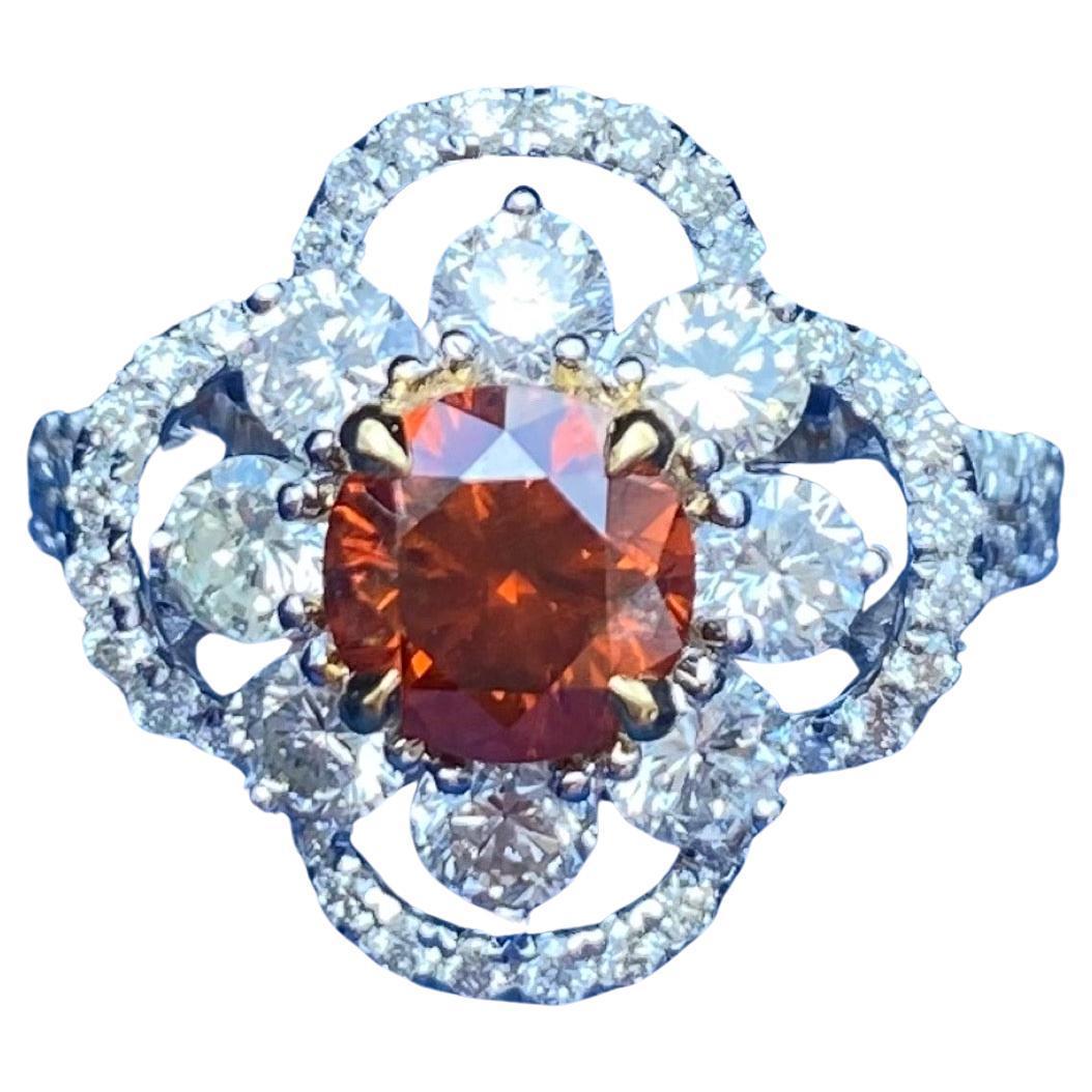
- Set with 1 brilliant-cut Fancy Deep Brownish Orange Diamond 1.04 carat,  surrounded by brilliant-cut round diamonds of 8pcs total around 1.3ct .
- Size: US 7.5
- AU750 Gold
- Accompanied by GIA Report no. 2235275589, June 14, 2024, stating that