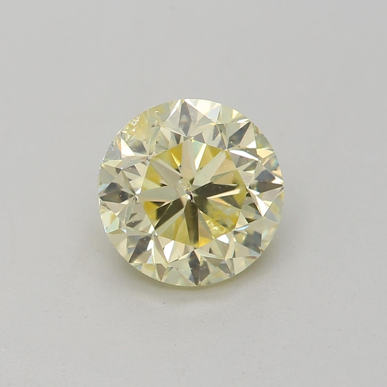 Certificate: GIA 
Report Number: 7436898832
Shape And Cut: Round
Carat Weight: 1.04 carat
Measurements: 6.18 x 6.11 x 4.06 mm
Color Grade: Fancy Light Yellow

FEATURES OF THE DIAMOND:

This fancy light yellow diamond is a delicate and subtle diamond