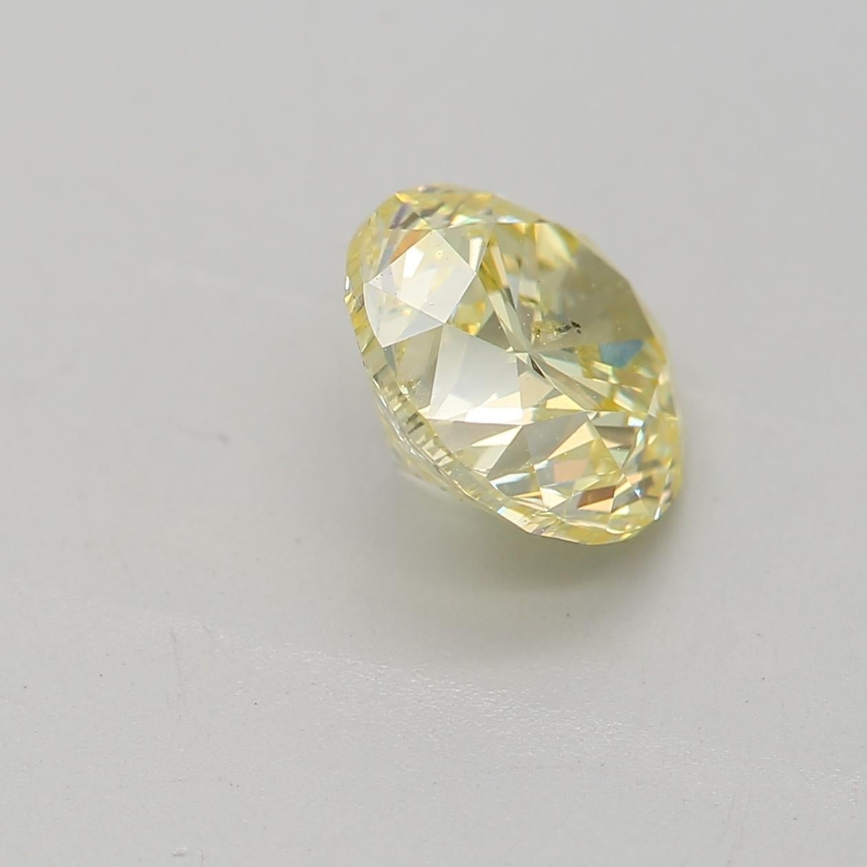 Women's or Men's GIA Certified 1.04 Carat Fancy Light Yellow I2 Clarity Diamond For Sale