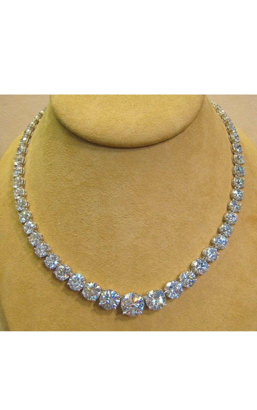 Behold the enchantment of royalty with this Masterpiece of riviera Diamonds queen necklace.
The lustrous centre GIA Certified 4.00 carat Diamond is truly captivating, while the 100 carats of dazzling diamonds illuminate like bursts of exquisite