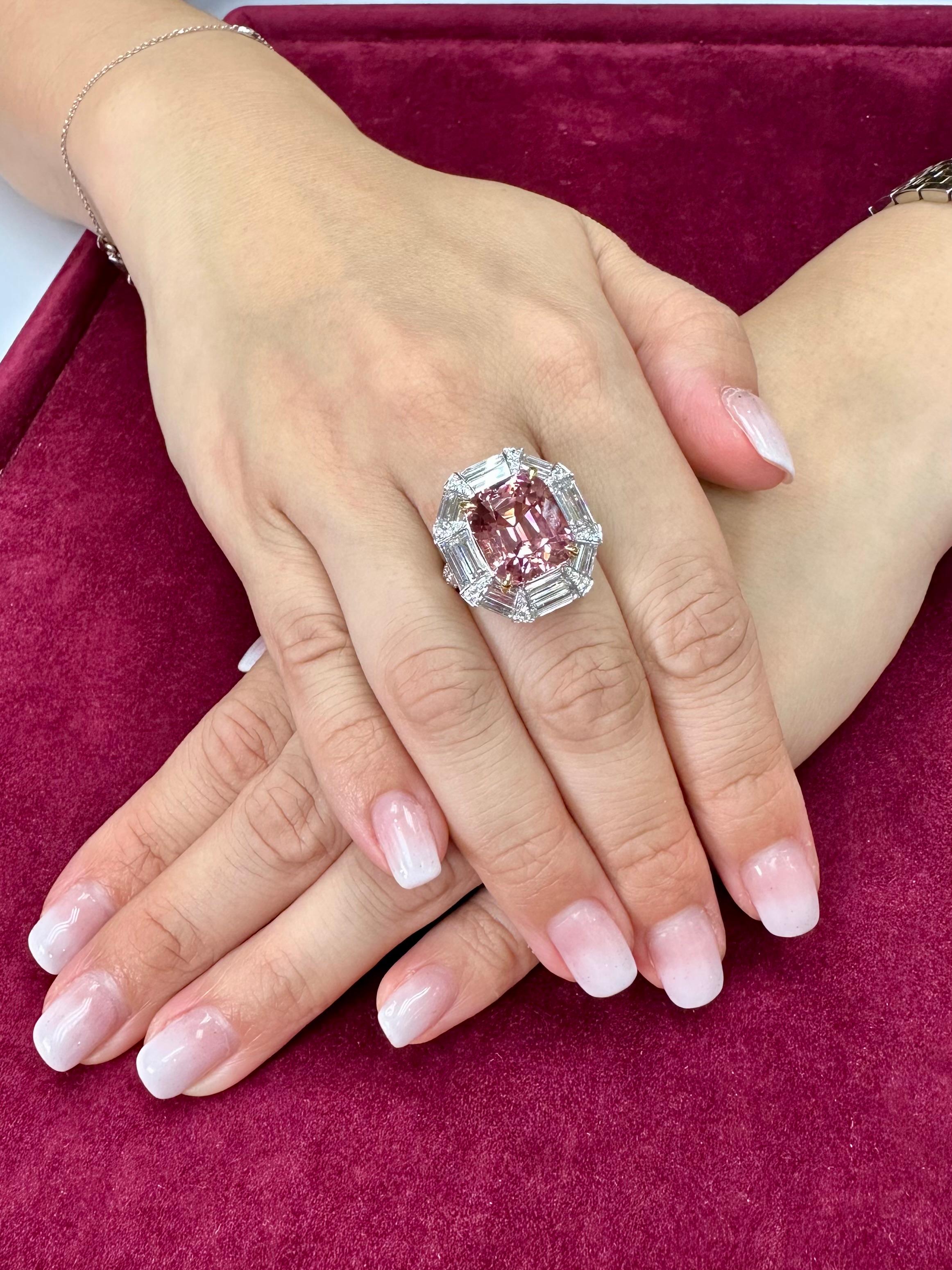 Please check out the HD video! Here is a large oversized 10.43 cts pink tourmaline and diamond ring. The 18k white gold mounting is set with 3.23cts of specialty cut diamonds and 0.68cts of round diamonds. All in all a total of 3.91cts of diamonds.