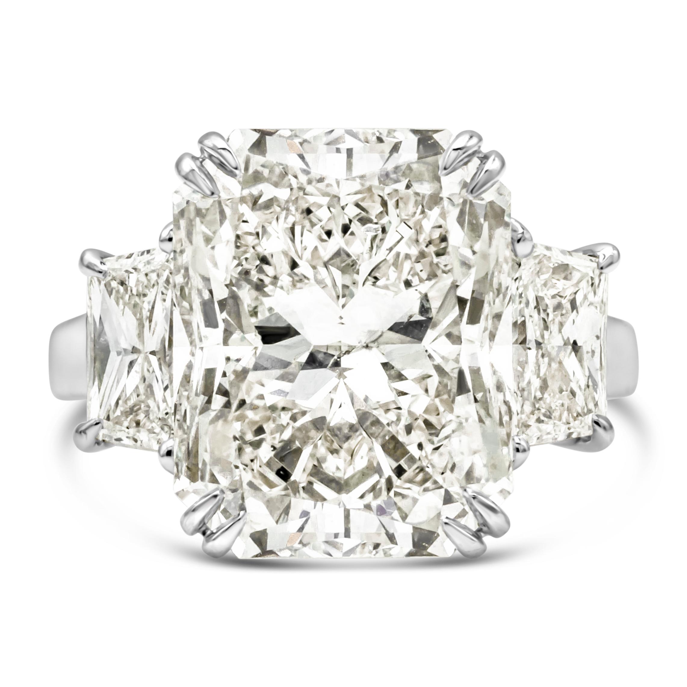 Finely made and well crafted three stone engagement ring featuring a 10.44 carats radiant cut diamond certified by GIA as K color, I1 in clarity, set in a beautiful eight prong basket setting. Flanked by brilliant trillion cut diamonds on each side