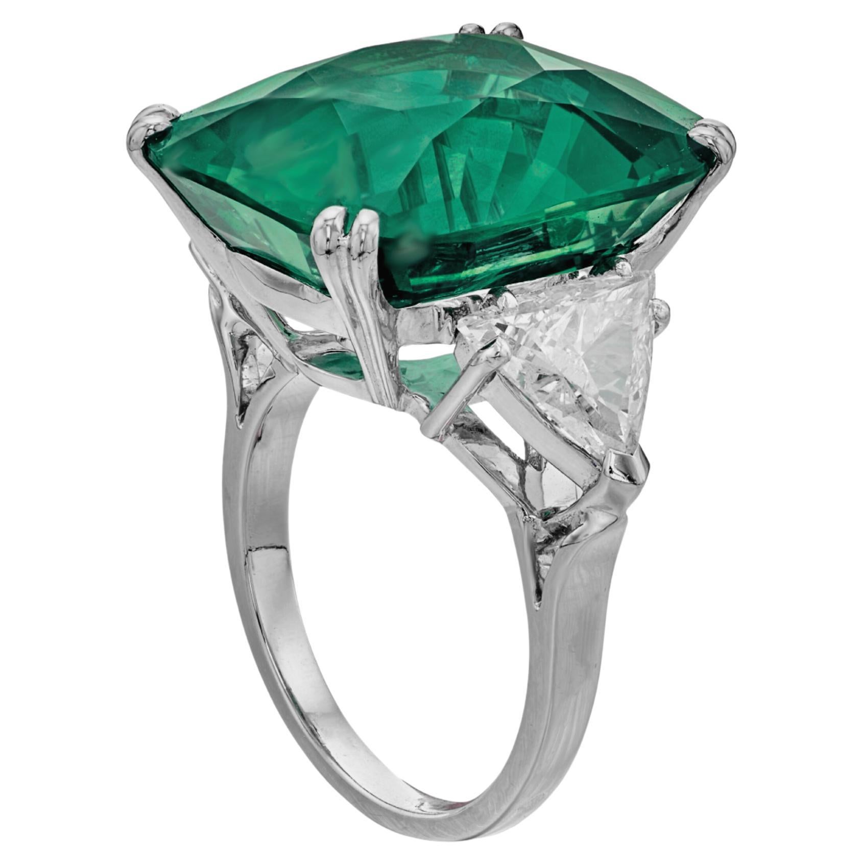 Indulge in timeless elegance with this breathtaking ring, featuring a substantial 10.49 carat cushion-cut emerald, certified by GIA.

This masterpiece is mounted in platinum for a luxurious finish. With its exceptional spread, this EMERALD appears