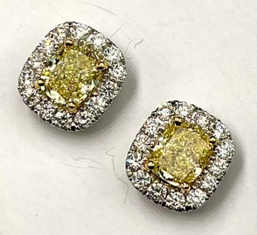 These earrings feature a perfectly matched set of 2 Radiant Cut Natural Fancy Yellow Diamonds. The yellow hue of these diamonds leans closer to Fancy Intense and the clarity is extremely high with one diamond being Internally Flawless and the other