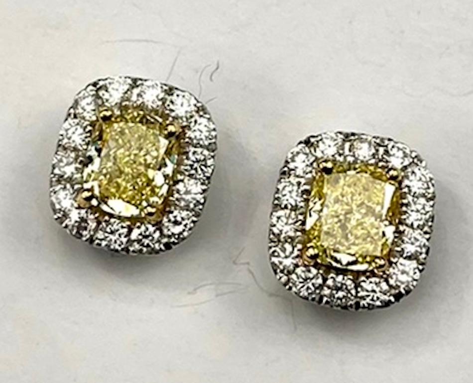 Contemporary GIA Certified 1.04Ct and 1.03Ct Radiant Natural Fancy Yellow Diamond Earrings For Sale