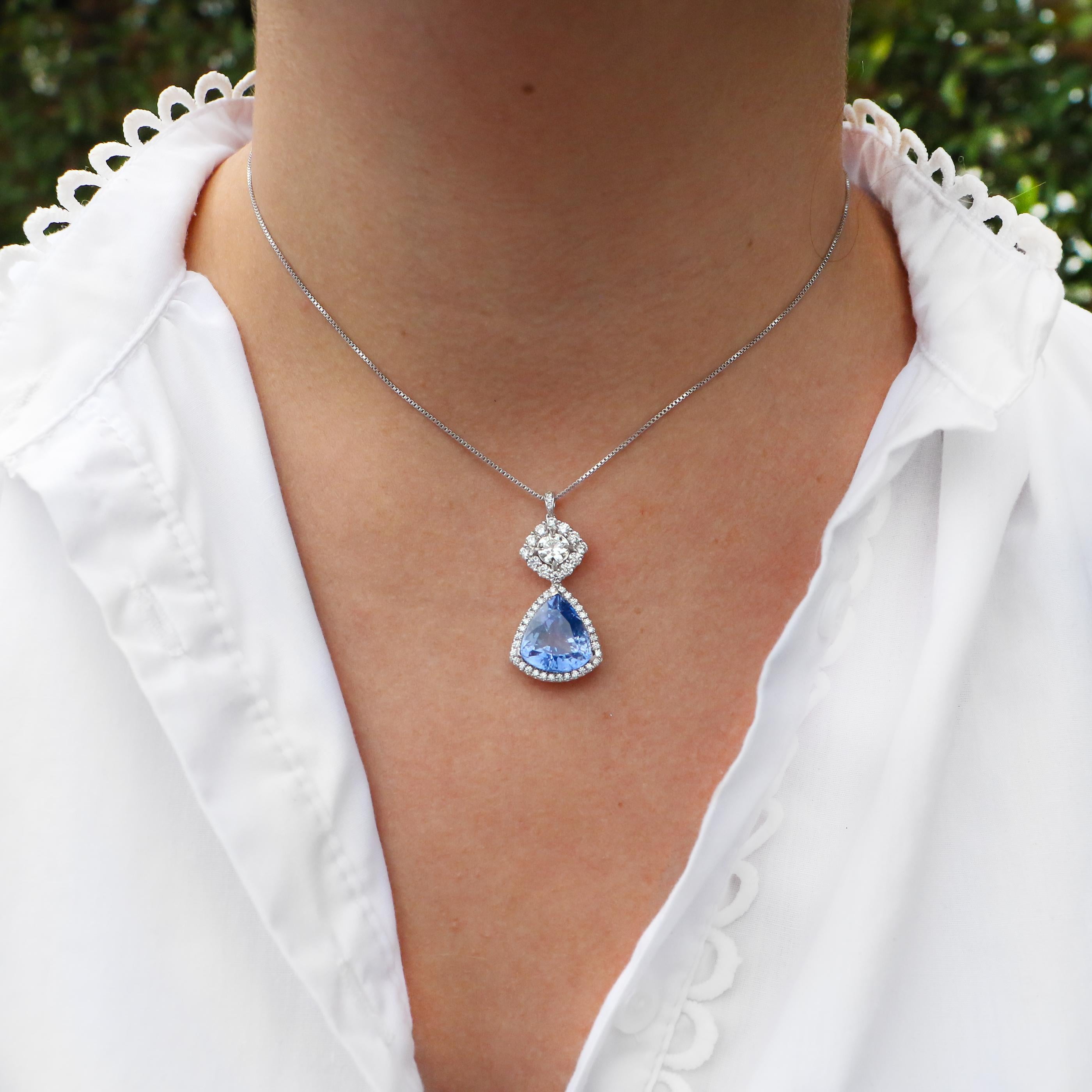 Apart of the wide variety of jewelry we have for sale. This pendant boasts a beautiful sapphire, surrounded by diamonds. The sapphires trillion cut makes the light reflect off of each beautiful edge.

• 10.50 Carat Sapphire
• GIA Certified
• 2.25