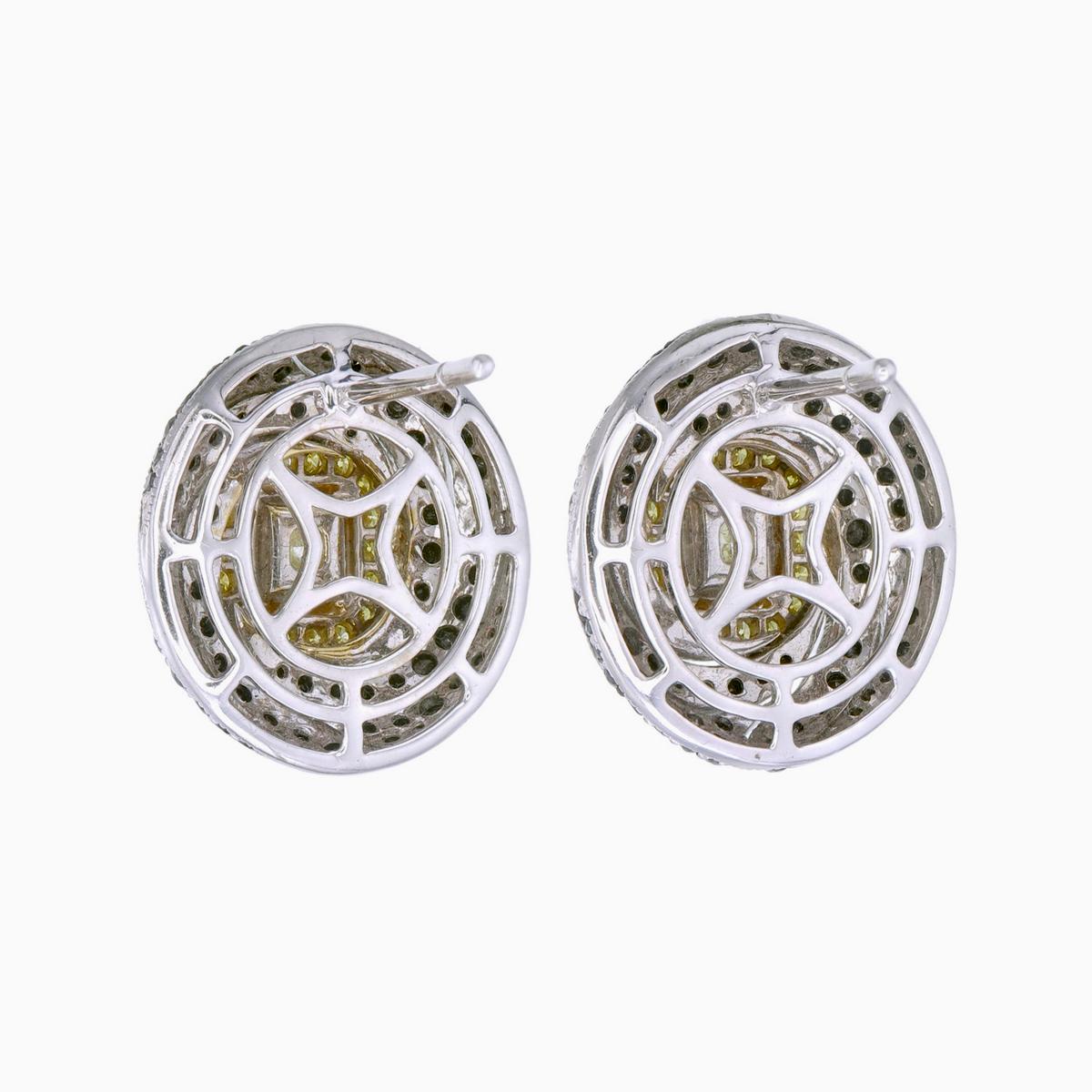 Women's GIA Certified 1.06 carat Fancy Yellow and Black Diamond Spiral Stud Earrings For Sale