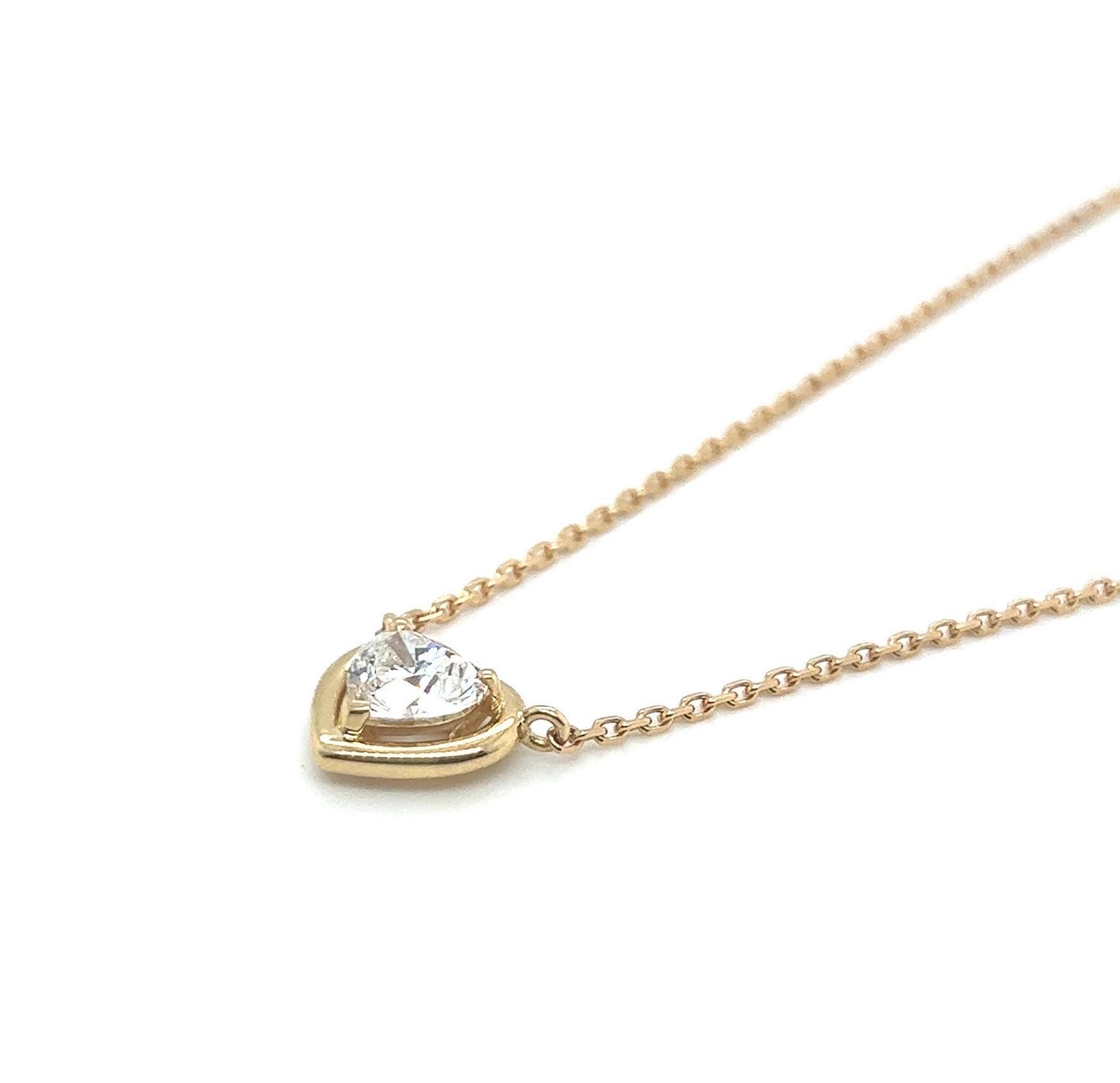 Elegant GIA certified 1.06 carat heart-shaped diamond and 18 karat yellow gold necklace.

Crafted in yellow gold 750, the necklace centers upon a heart-shaped diamond of 1.06 carats, F / VS1, set in a heart-shaped three-prong setting. It is