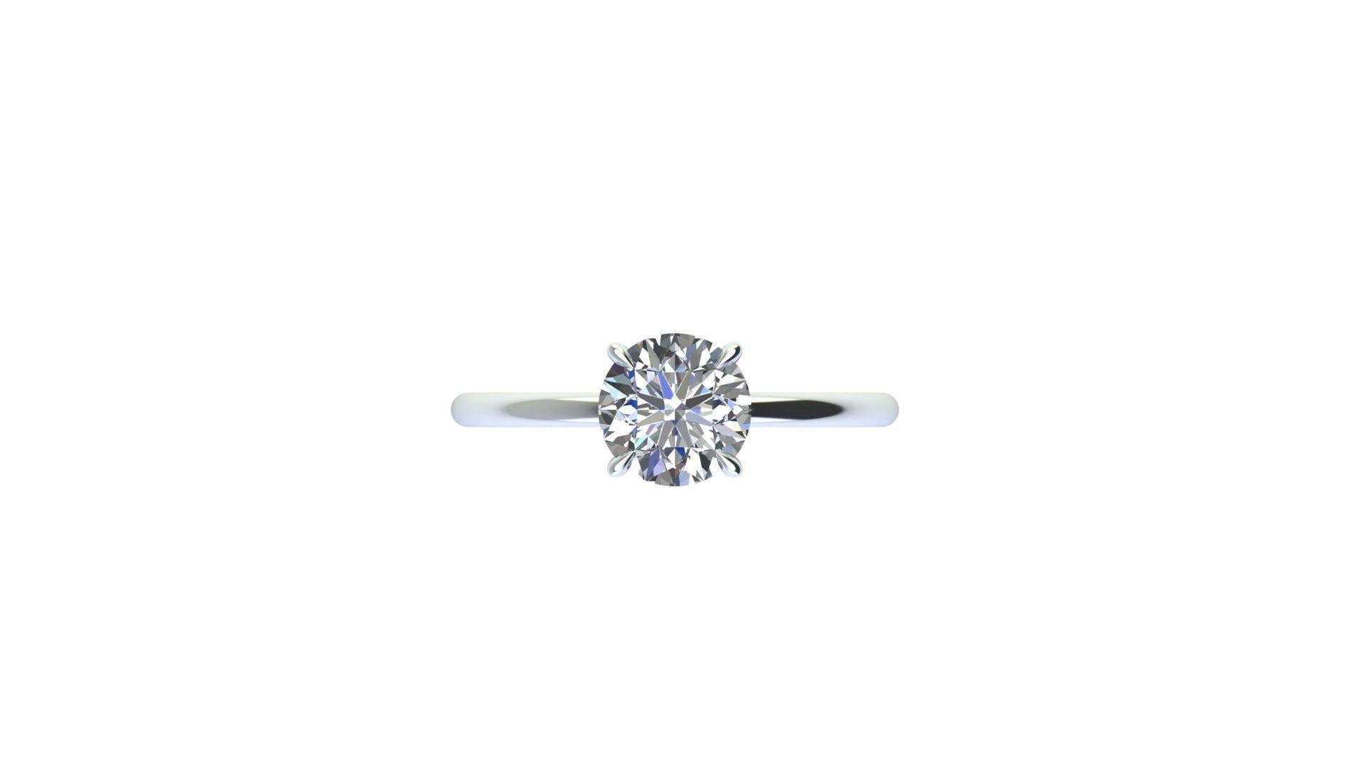 GIA Certified 1.01 Round diamond, G color, VS2 clarity with Triple Excellent Specs, in a high demand minimalistic, thin, low setting, four claw prongs, rounded wire shank.

This ring is a standard size 6 and Complimentary finger size change upon