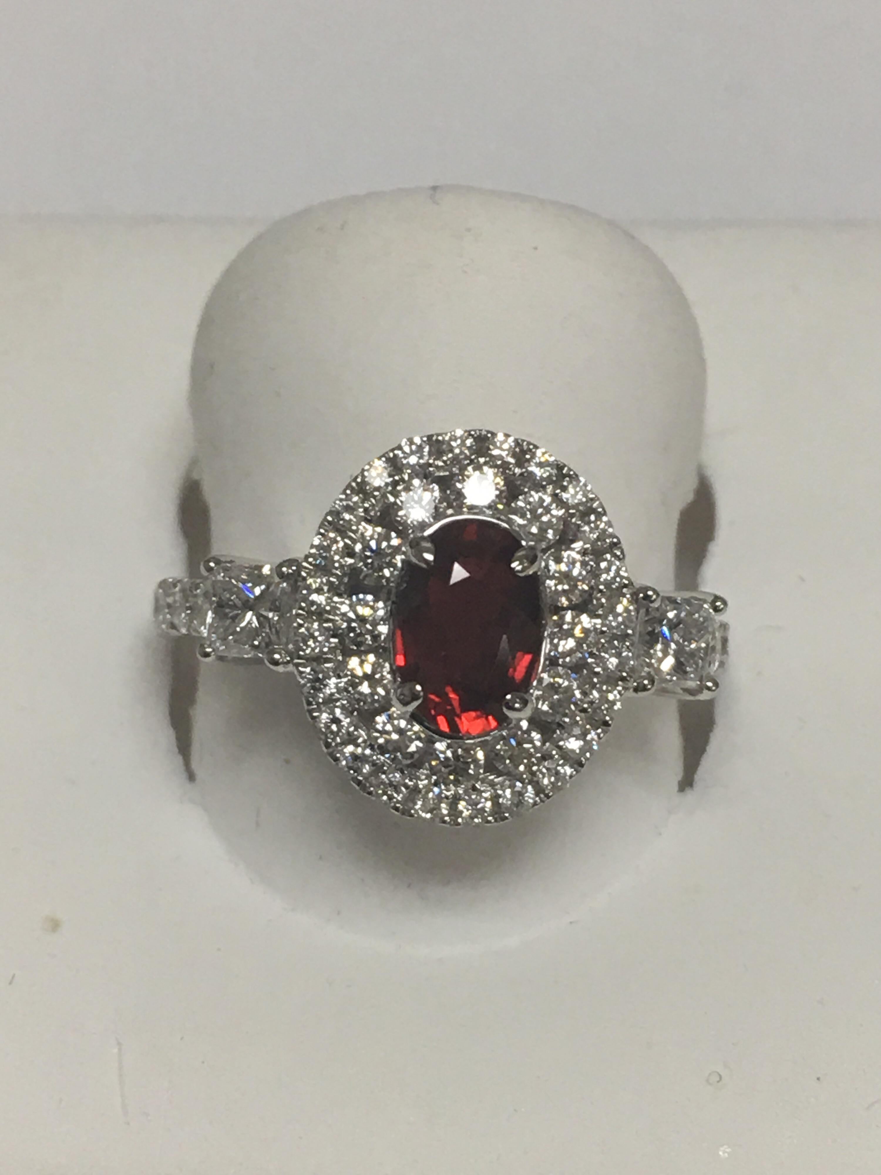 GIA Certified 1.06 Carat Ruby and 1.06 Carat White Diamonds accents set in 18 Karat white Gold.The Ring is handcrafted one of a kind by skilled craftsman.Size of the ring is 7 but can be resized if needed.