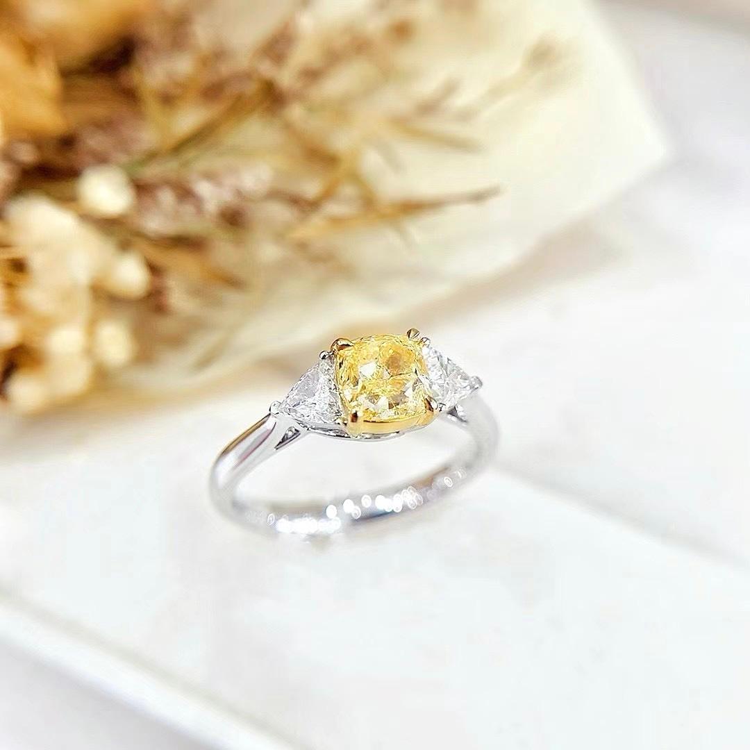 GIA Certified 1.06 CT Fancy Light Yellow Diamond Three-Stone Ring

1 Fancy Light Diamond - 1.06 CT
Cushion Shape
Clarity Grade - VS2

2 Diamonds - 0.39 CT
Total Weight - 3.72 GM