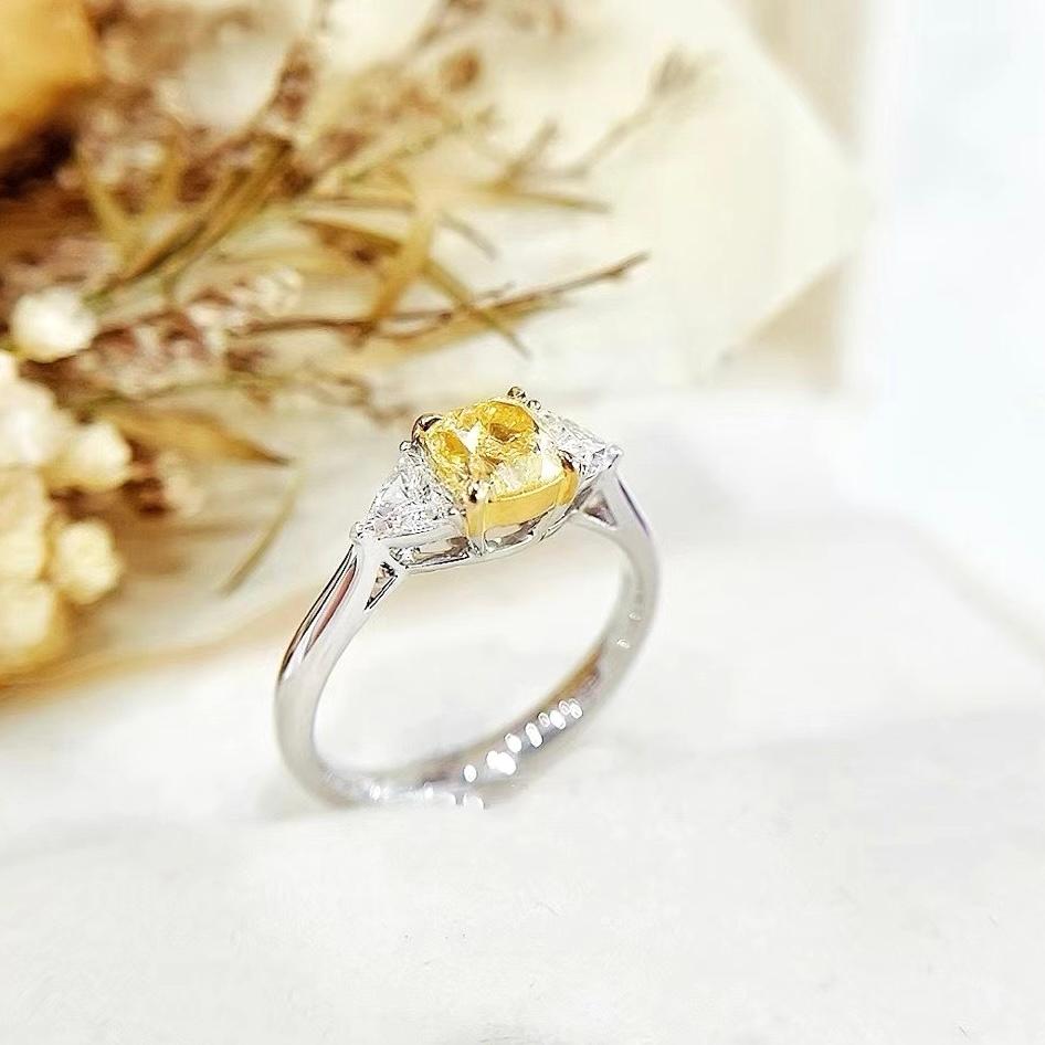 Modern GIA Certified 1.06 CT Fancy Light Yellow Diamond Three-Stone Ring For Sale