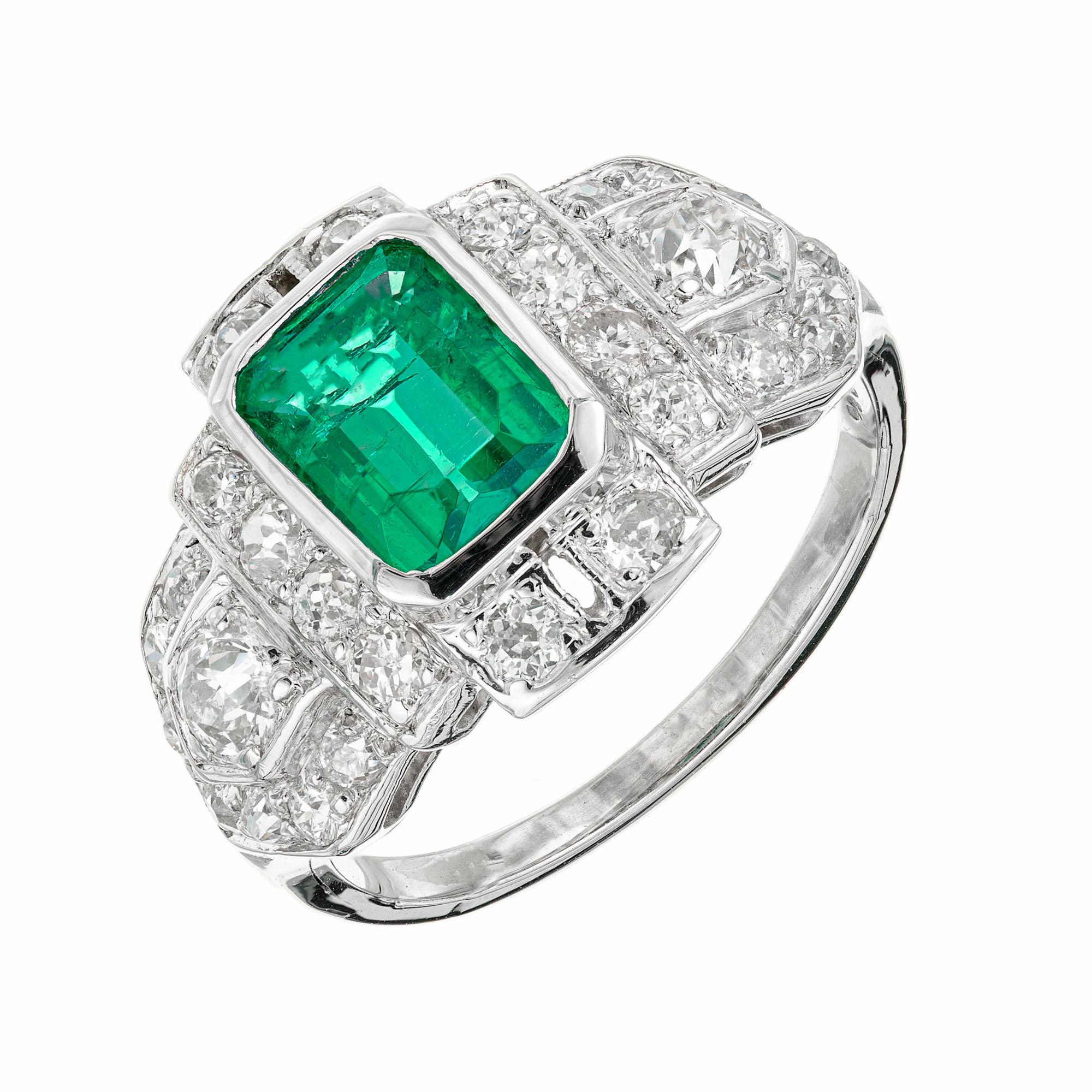 1930's Art Deco hand crafted emerald and diamond platinum ring. GIA certified natural, untreated bezel set octagonal emerald in a platinum setting accented with 28 old European cut diamonds. Emerald has not indications of clarity enhancement. 

1