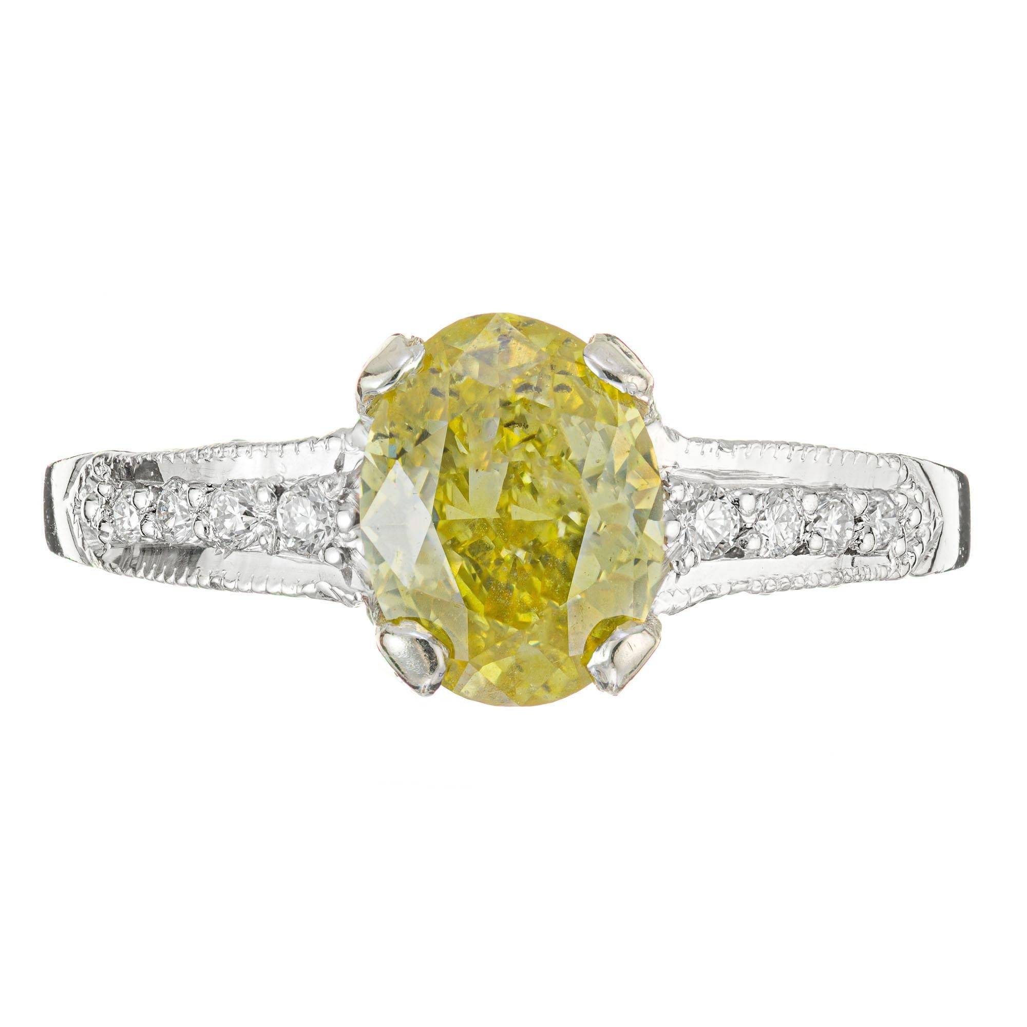 1960's Fancy oval yellow diamond engagement ring. 1.07ct GIA certified fancy yellow oval diamond in a platinum setting with 30 round full cut micro pave accent diamonds. 

1 Very rare 1.07ct oval deep yellow diamond GIA certificate #5111919234, I