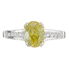 GIA Certified 1.07 Carat Oval Fancy Yellow Diamond Platinum Engagement Ring