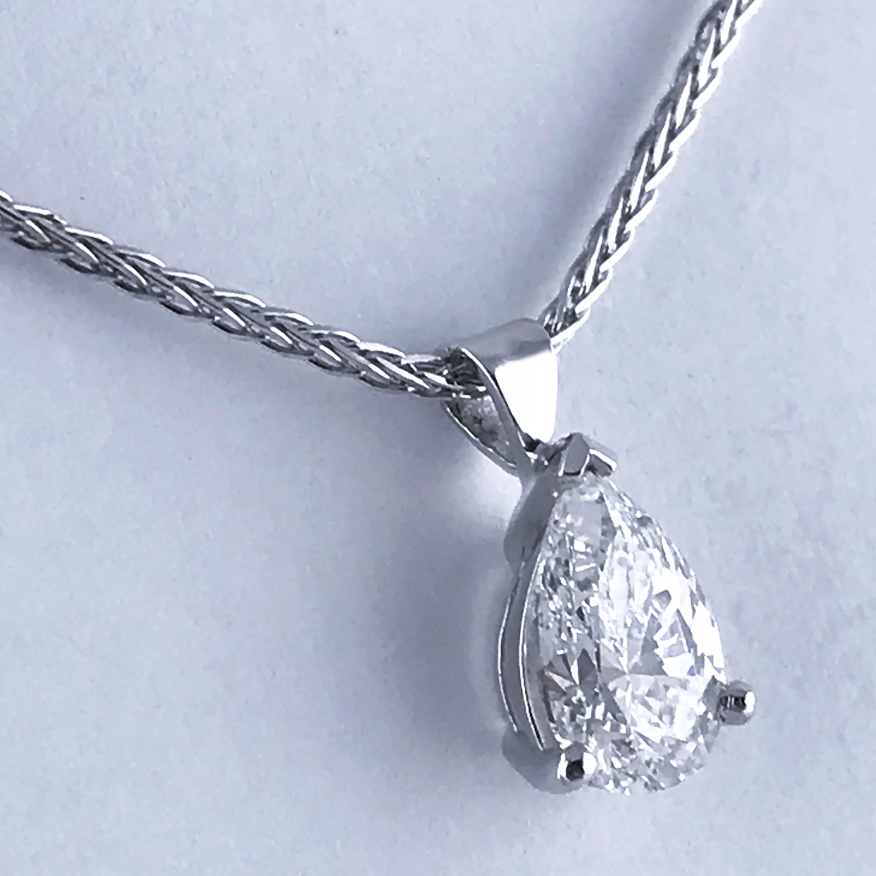 GIA Certified Pear shape diamond drop of very good colour and clarity on a platinum chain.

Diamond, Pear shape brilliant cut, 1.07 carats, E, VS1 (Certificated) mounted in platinum.

Dimensions:

Pendant (Diamond in setting)

Height 9mm
Width