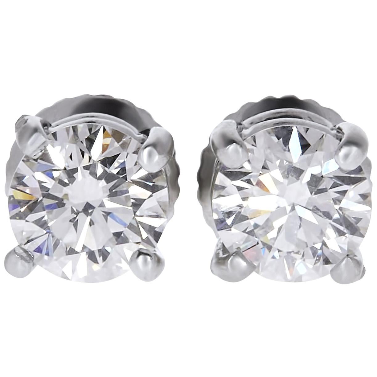GIA Certified 0.75 Carat VS Round Diamond Solitaire Stud Earrings 14 Karat Gold For Sale