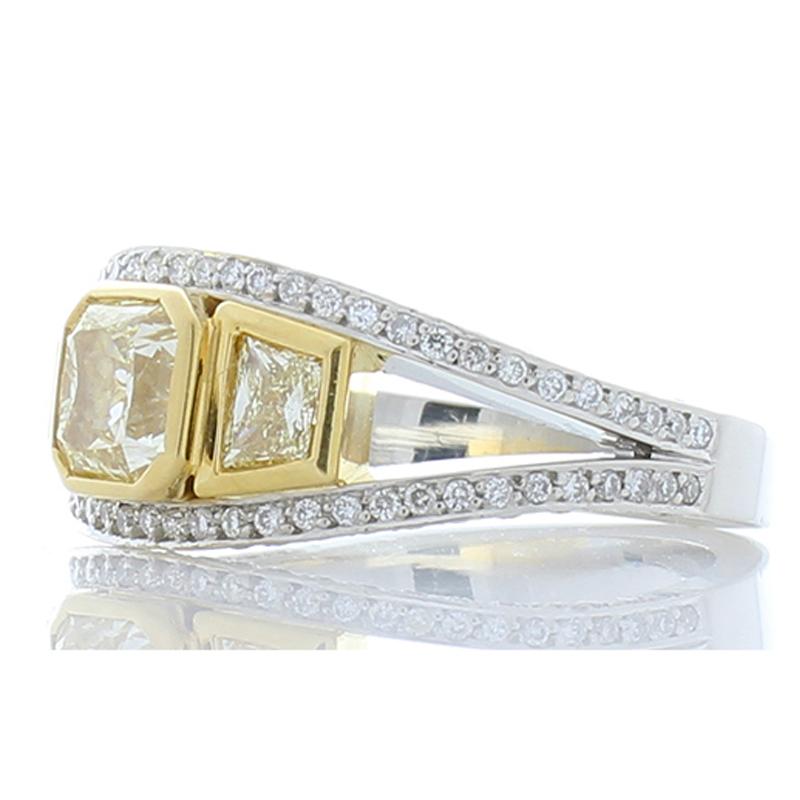 Before we get into the details, take a moment to soak in the lavishness and exceptional beauty of this ring. It�’s made to turn heads and endure for a lifetime. A richly saturated natural Radiant-cut, lemon-yellow diamond adorn the center while