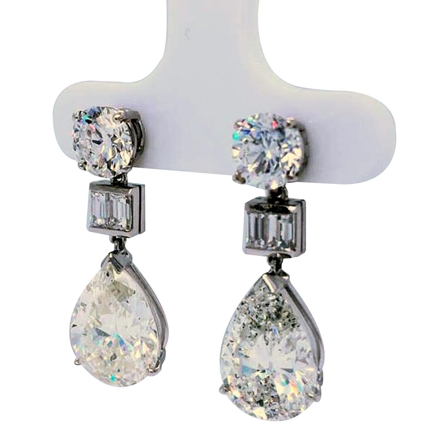 Details:
10.70Ct. Diamond Drop Earrings Mounted with a Pear Diamond 4.01 Ct. GIA #5211688866 J Color I1 Clarity Along with a Round  1.09 Ct. Diamond F - Color, VS1 Clarity GIA #6213945348 And Diamond 4.00 Ct. GIA #2211688860 K Color I1  Clarity