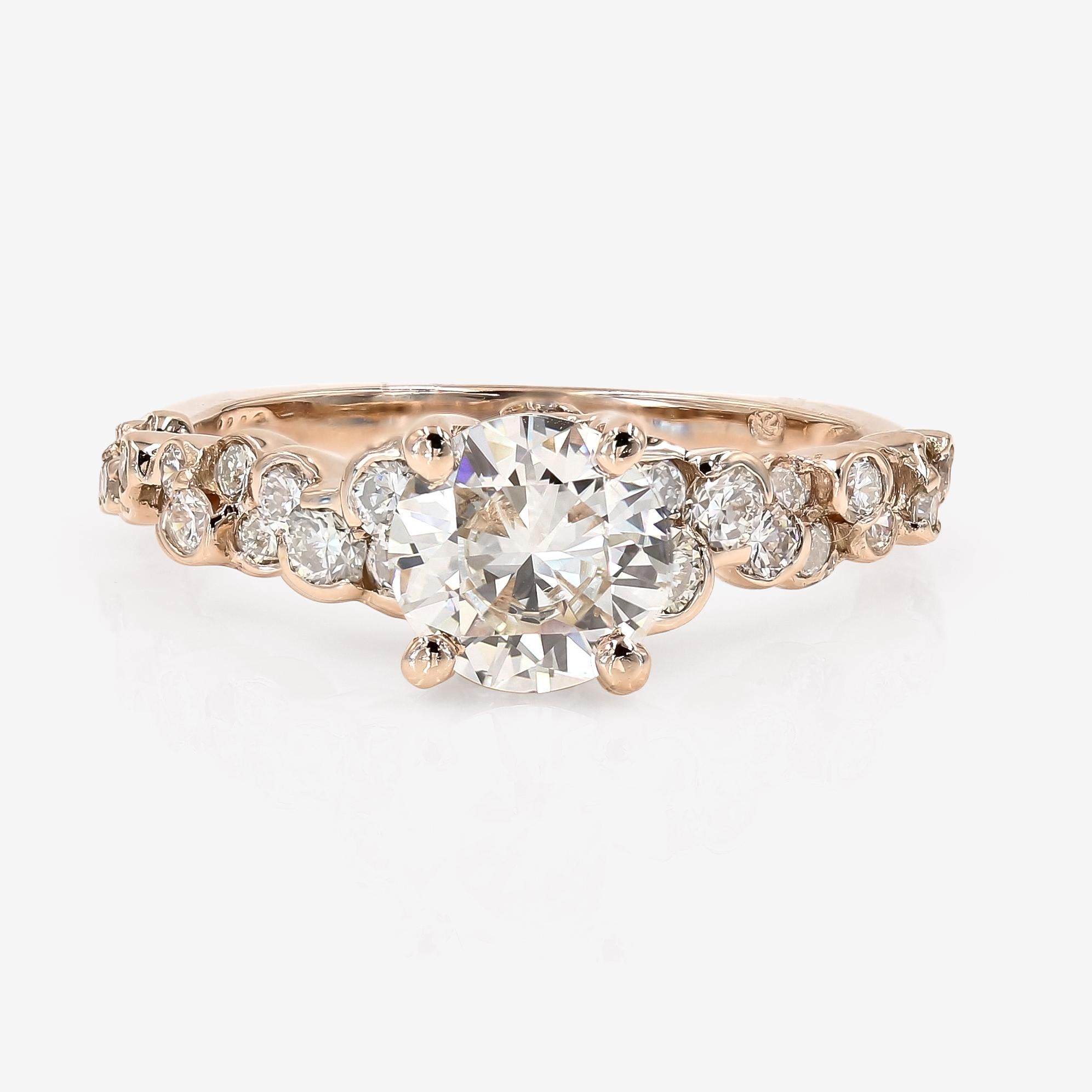 This Lester Lampert original CumuLLus® setting in 14kt. rose gold features a 1.08cts. round cut center that is J in color and VS2 in clarity. Down the sides of the shank are 36 ideal cut round diamonds=.73ct. t.w. The round diamonds are H-I in color