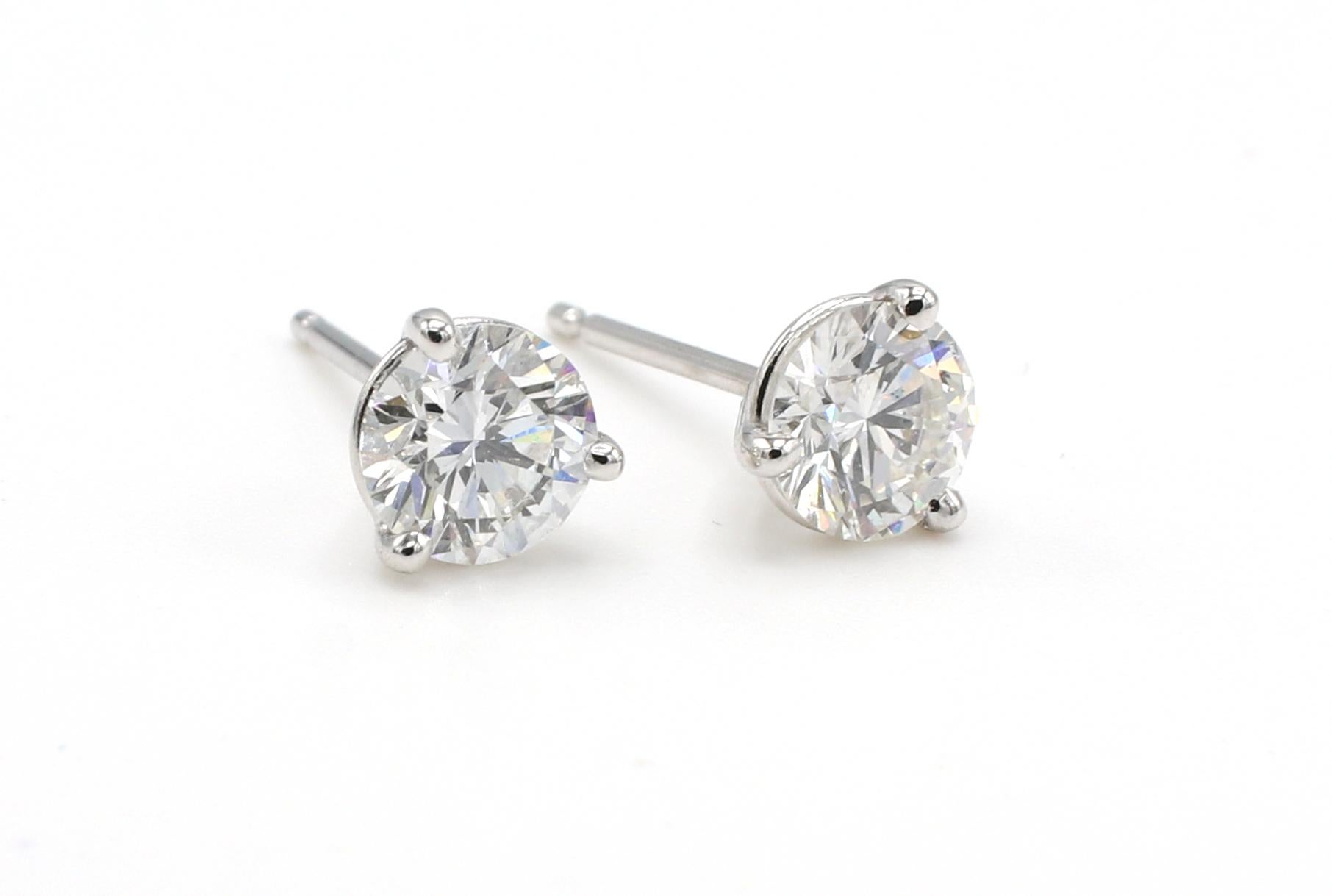 GIA Certified 1.08 Carat Round Natural Diamond White Gold Martini Stud Earrings 
GIA report numbers: 1216273443 & 2211273462 (see reports pictured for details) 
Diamonds: Round Brilliant 0.55 E SI2 & 0.53 E SI2 natural diamonds
Metal: 14k white
