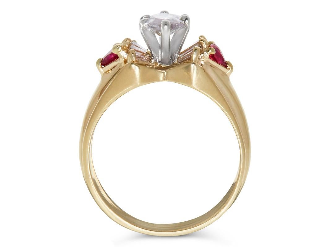 Lovely 1.09 Carat Fancy Faint Pink Marquise Diamond and Ruby Ring in 14K Yellow Gold. Certified by GIA Lab in New York, with full color diamond grading report. 

GIA 0.74 Faint Pink Marquise Diamond center,
0.15 Carats of Baguette White VS-SI
