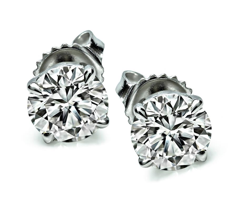 This is a stunning pair of 14k white gold stud earrings. The earrings feature sparkling GIA certified round cut diamonds that weigh 1.09ct and 1.03ct. The color of the diamonds is I with VS2 clarity and I with SI clarity respectively. The earrings