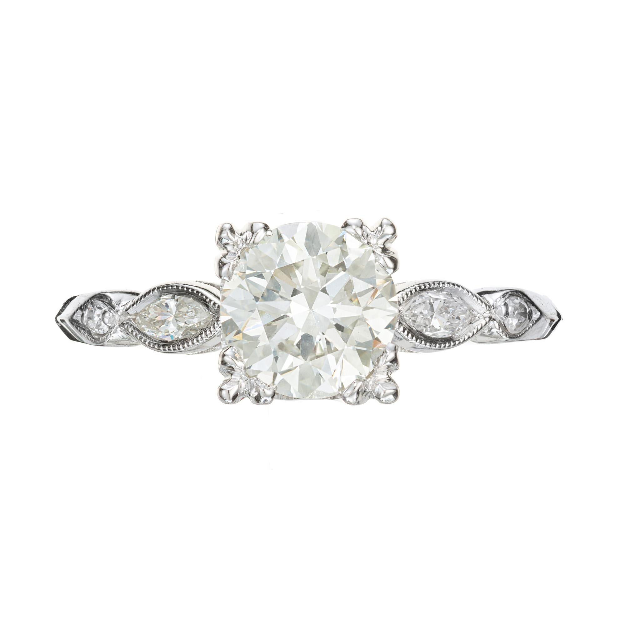 1940's Diamond engagement ring. GIA certified round brilliant cut center diamond with 2 marquise and 2 round brilliant cut side diamonds. Transitional 1940's cutting makes the diamond whiter and brighter.

1 round brilliant cut diamond, K VS2