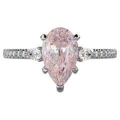 GIA Certified 1.10 Carat Fancy Light Pink Diamond Three Stone Ring