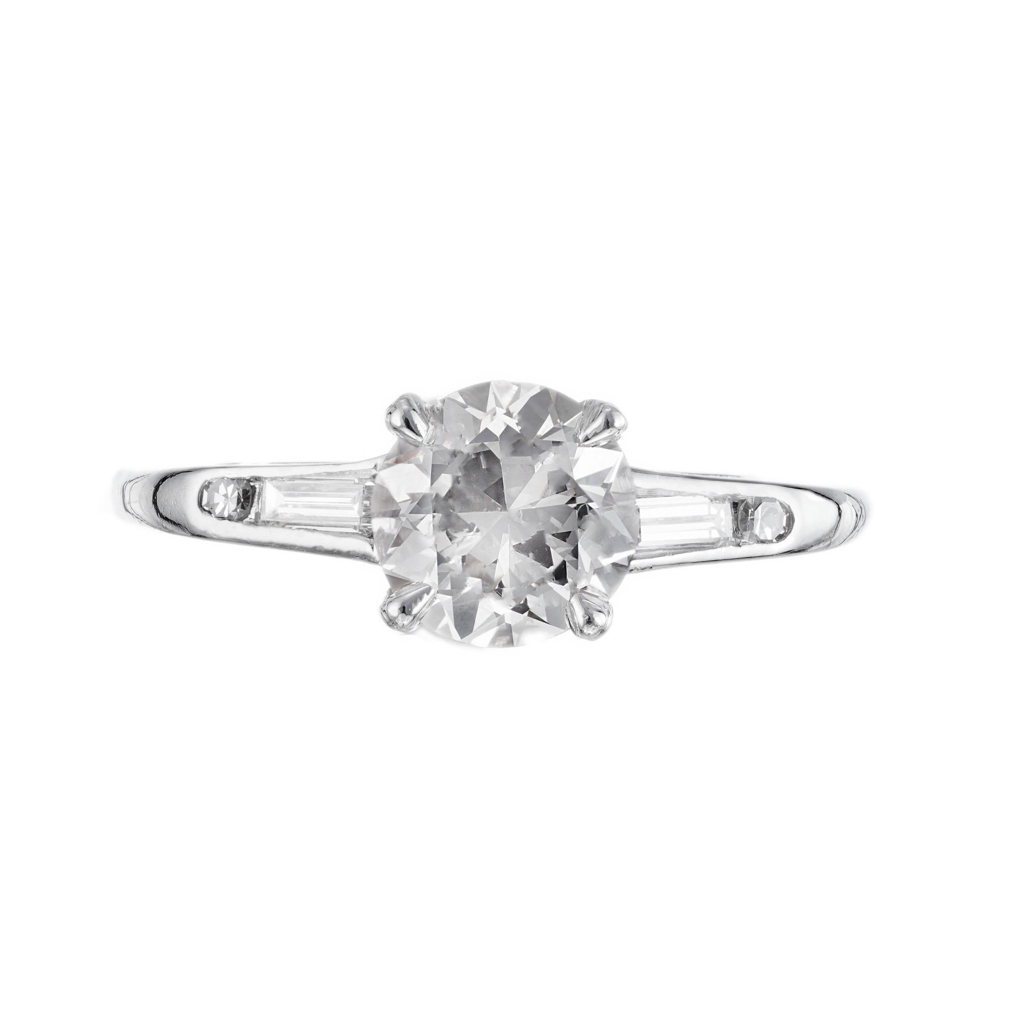 GIA certified Natural faint brown round diamond engagement ring. Platinum setting with two round and two baguette accent diamonds.  

1 diamond approx. total weight 1.11cts, 6,50 x 6.69 x 4.19mm. Eye clean. SI2 clarity. 63.5% depth. 59% table. GIA