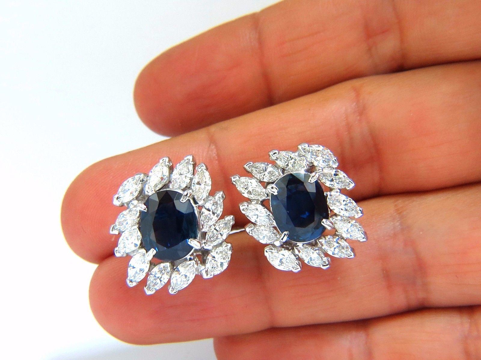 GIA Certified 3.74ct & 3.62Ct Natural Blue sapphire earrings.

Report # 2173124301

VS clean clarity / Transparent

Classic Royal Blue

10.25 X 8.15 X 4.73mm

10.30 X 8.02 X 4.32mm

3.80ct Side natural Marquise diamonds

G-color Vs-2 clarity.

Each