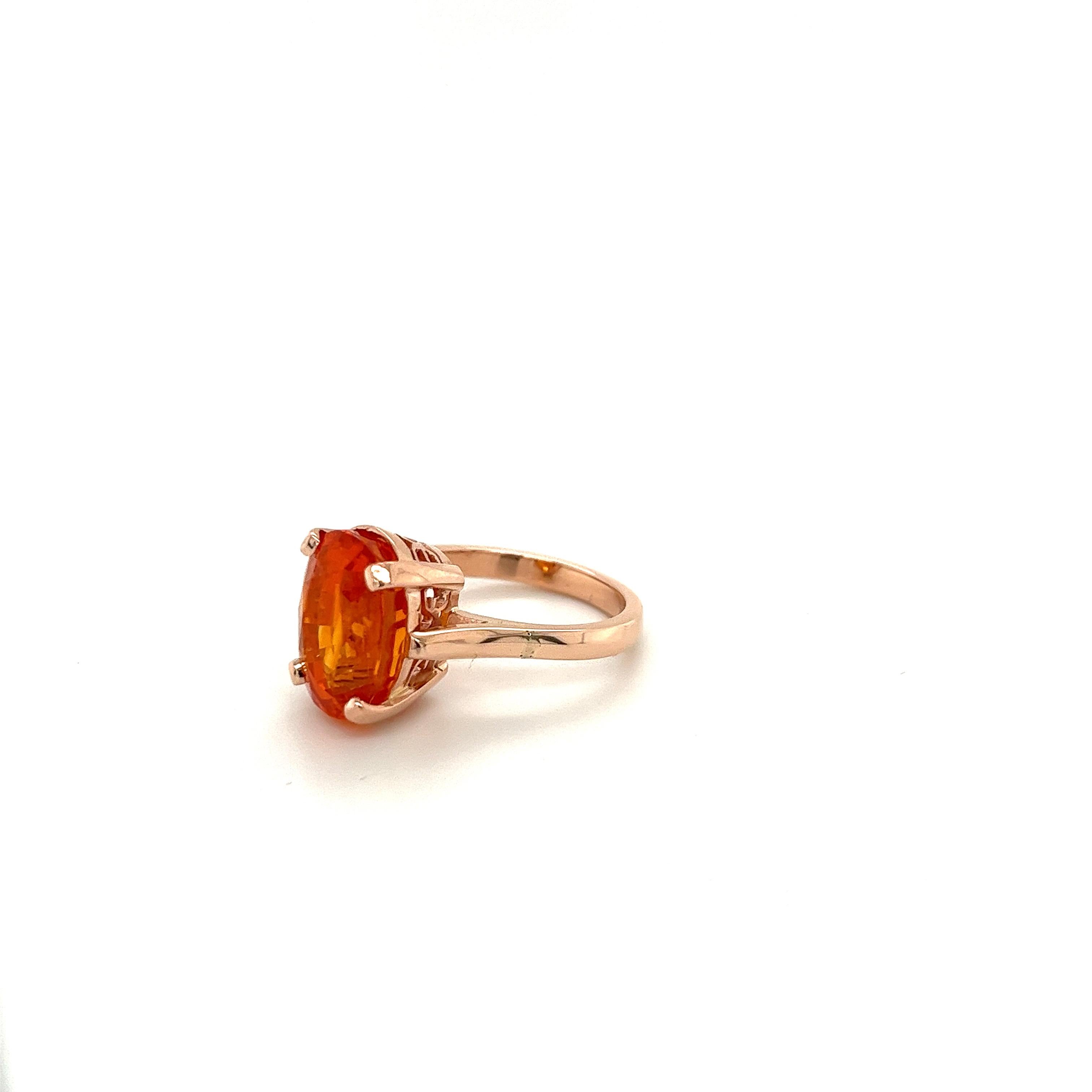 GIA certified 11 carat Orange Sapphire of Sri Lanka origin set in 14k solid rose gold cathedral solitaire ring with carved basket. 

For those searching for a fine quality Sapphire that's exploding with vibrance and color. Set in a solitaire 4-prong