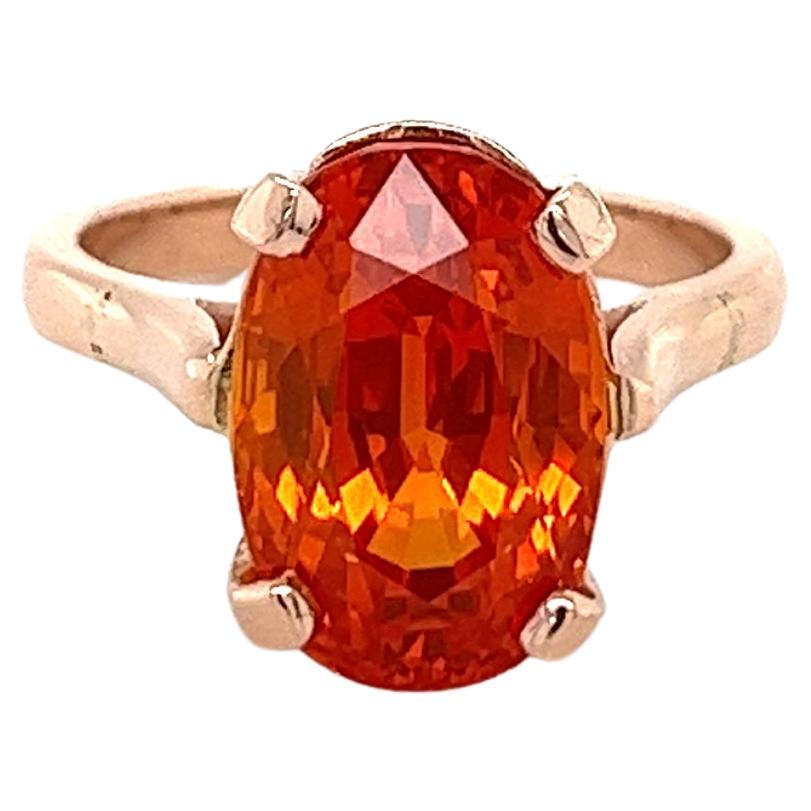 Saphir orange de taille ovale de 11,16 carats certifié GIA en or rose 14 carats en vente
