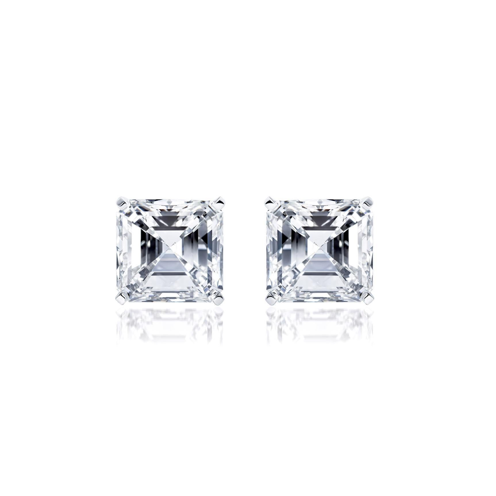 Sophisticated elegance with an edge.
These extraordinary gems weight in at over 5 1/2 carats each! for a total combined  carat weight of 11.18.  
Asccher cut diamonds of this quality are rare, a perfectly matched pair of this size is truly a