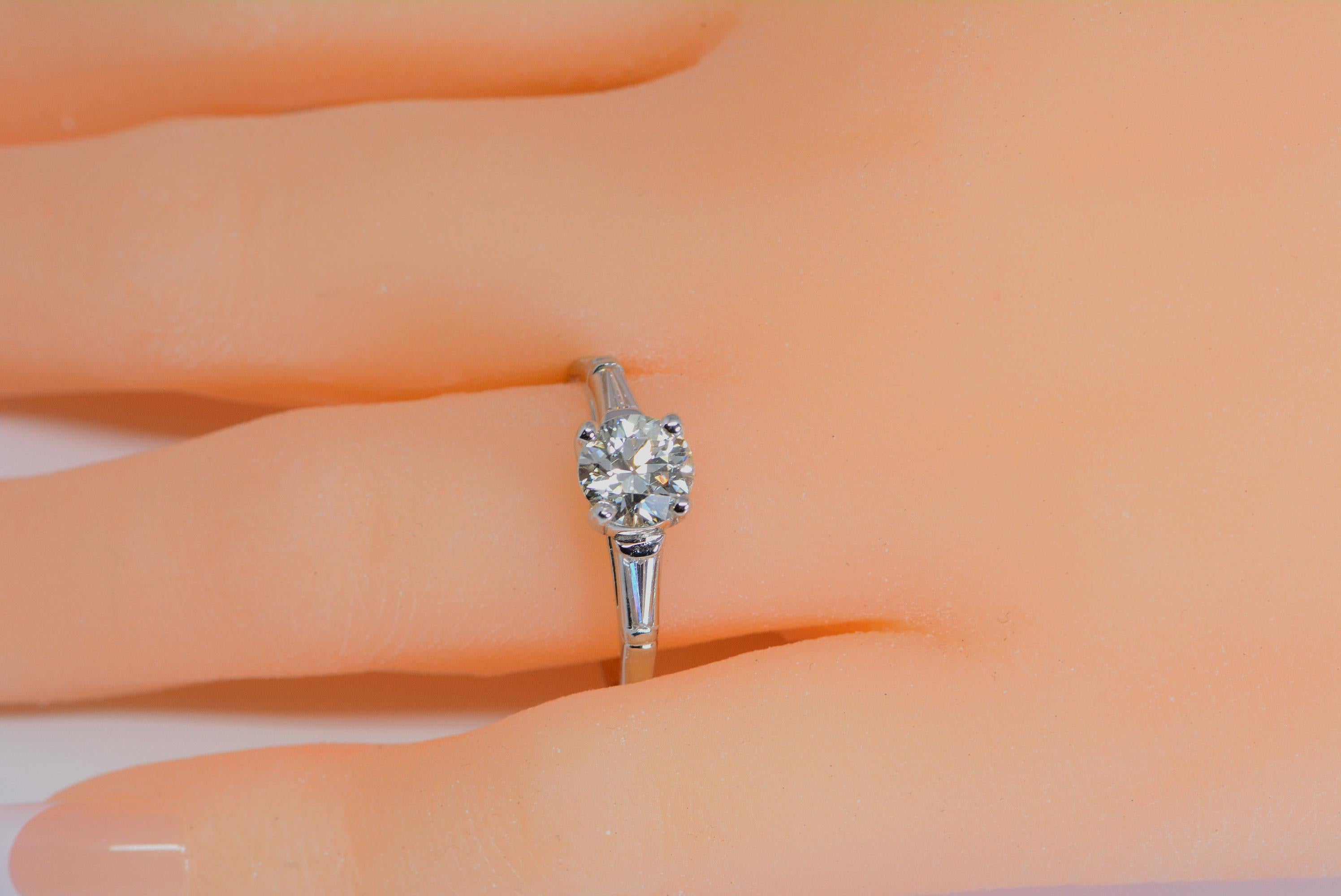 1.9 carat diamond ring on finger