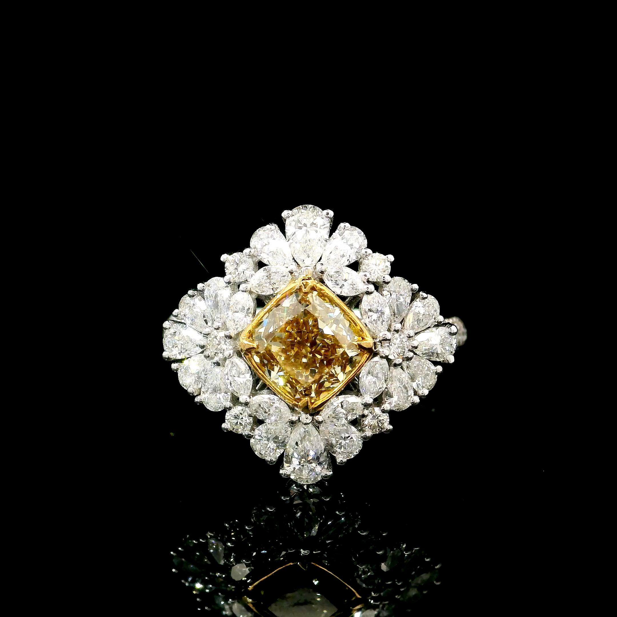 18kt white gold ring with diamonds
  
  Gold colour & karat: White gold 18kt
  Weight: 4.41 grams
  
  Set with-
  Stone type: Diamonds
  Shape: Cushion
  Carat: 1.12 ct
  Colour: Fancy Brownish Yellow
  Clarity: VVS1
  
  Surrounding Stones: