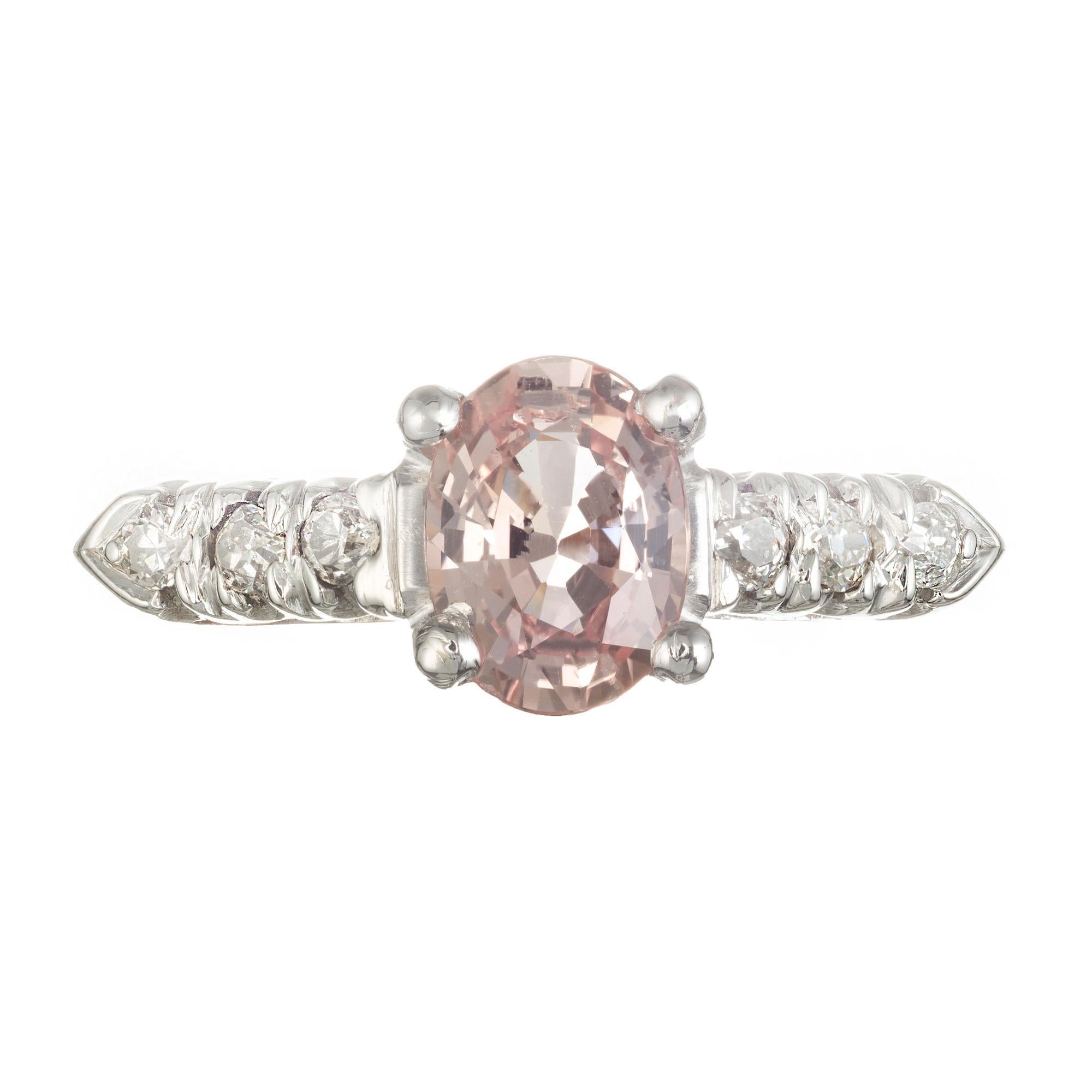 Vintage 1940's Natural 1.12 carat oval bright orange/pink sapphire and diamond engagement ring. Set in platinum 

1 oval brilliant light orange MI sapphire, Approximate 1.12 carats. GIA Certificate # 1176619027
6 round J-K SI diamonds, Approximate