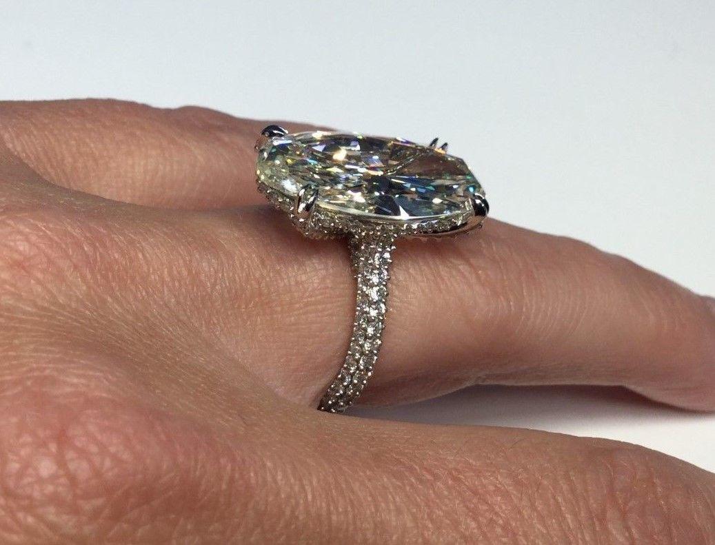 Modern GIA Certified 11.26 Carat Oval Shaped Diamond Platinum Engagement Ring For Sale