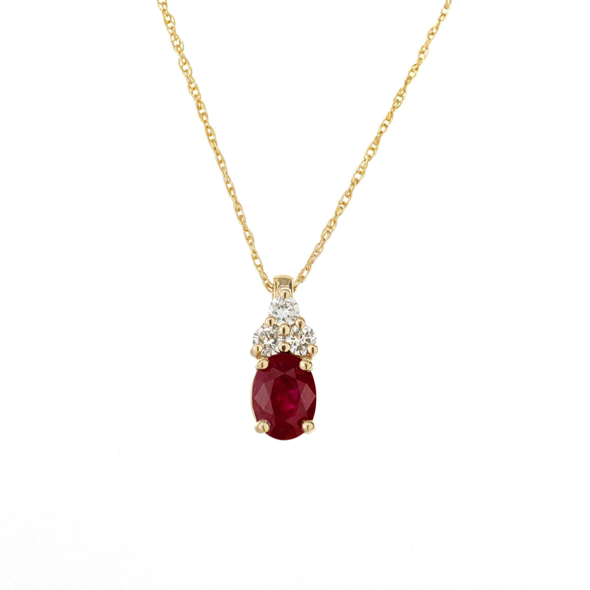 Ruby and diamond pendant necklace. GIA certified, Burma ( Myanmar) oval ruby 1.14 carat, set in a 14k yellow gold setting with 3 round brilliant cut diamond accents. Heated- moderate residue. 17 inch 14k yellow gold chain. 

1 oval red ruby approx.