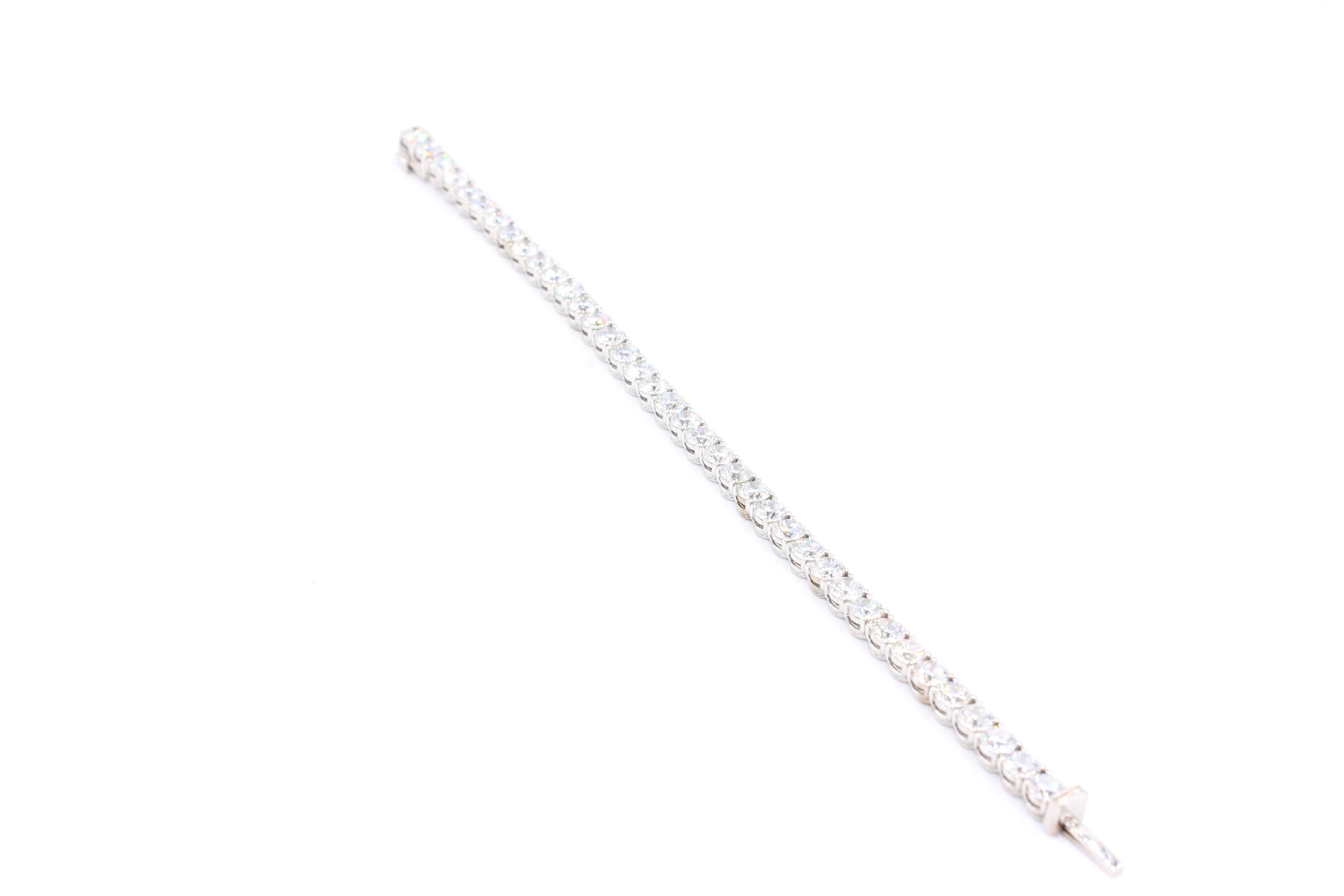 Classic Diamond tennis bracelet made of gold 18k weighting 16.80 grams. 

The bracelet is set with 38 diamonds for a total of 11.44 Carats. All diamonds are GIA Certified and weight on average 0.30 Carats. The diamonds are white with a color of D, E