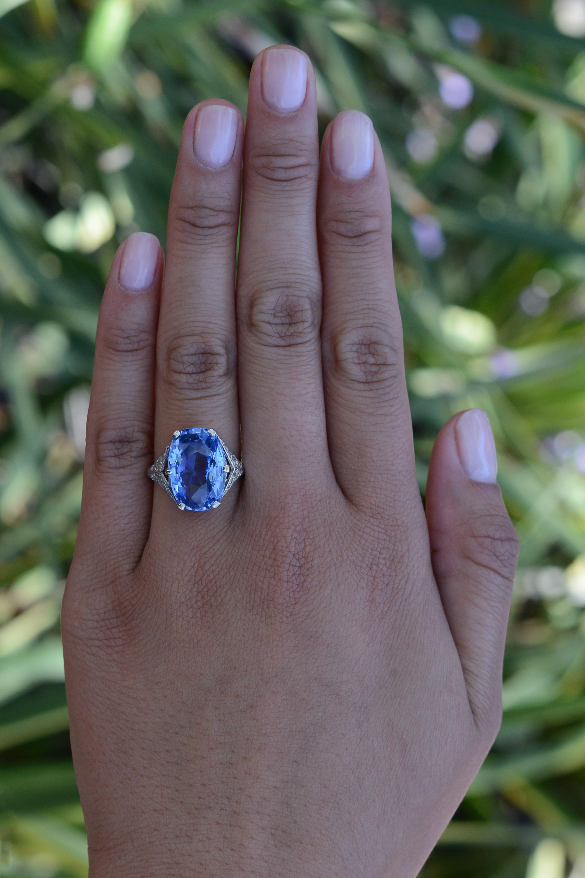 Lay witness to the jaw dropping beauty of this GIA certified antique sapphire Art Deco ring, a timeless treasure from the jazz age of the 1920s. Crafted of platinum, this artifact of high jewelry features a radiant oval faceted sapphire, sure to