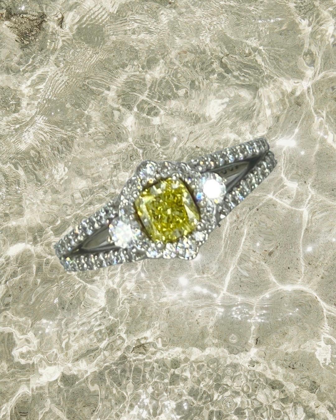 GIA Certified 0.56 Carat Center Natural Fancy Yellow Intense Diamond Engagement Ring.
GIA certificate # 15619202
The total carat in diamonds weights 1.15 carats.
The ring features a very rare Intense Yellow fancy color diamond center weighing 0.56